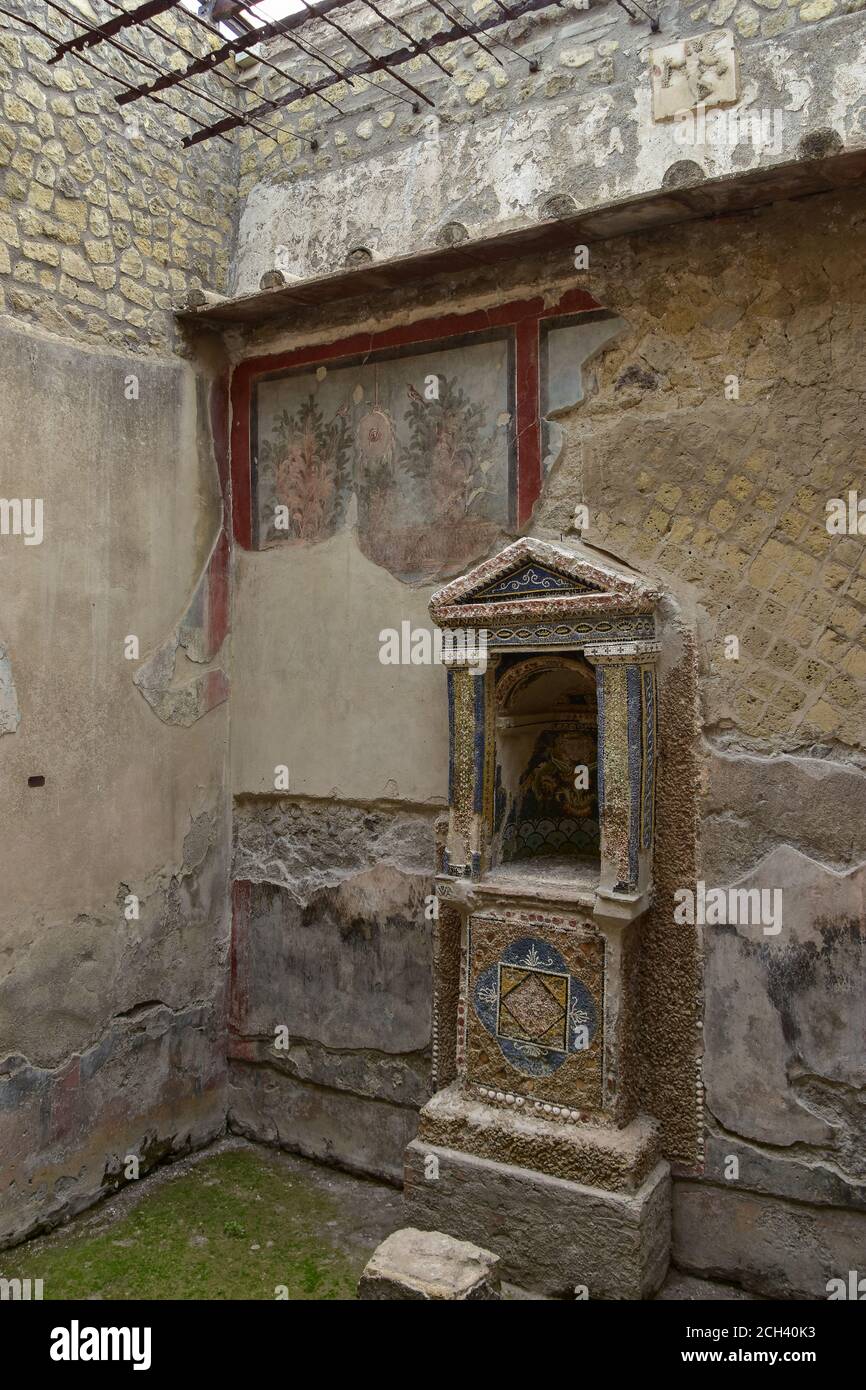 A mosaic lararium in a courtyard at the House of the Skeleton in Herculaneum, Italy, a Roman town destroyed by Mount Vesuvius in A.D. 79 Stock Photo