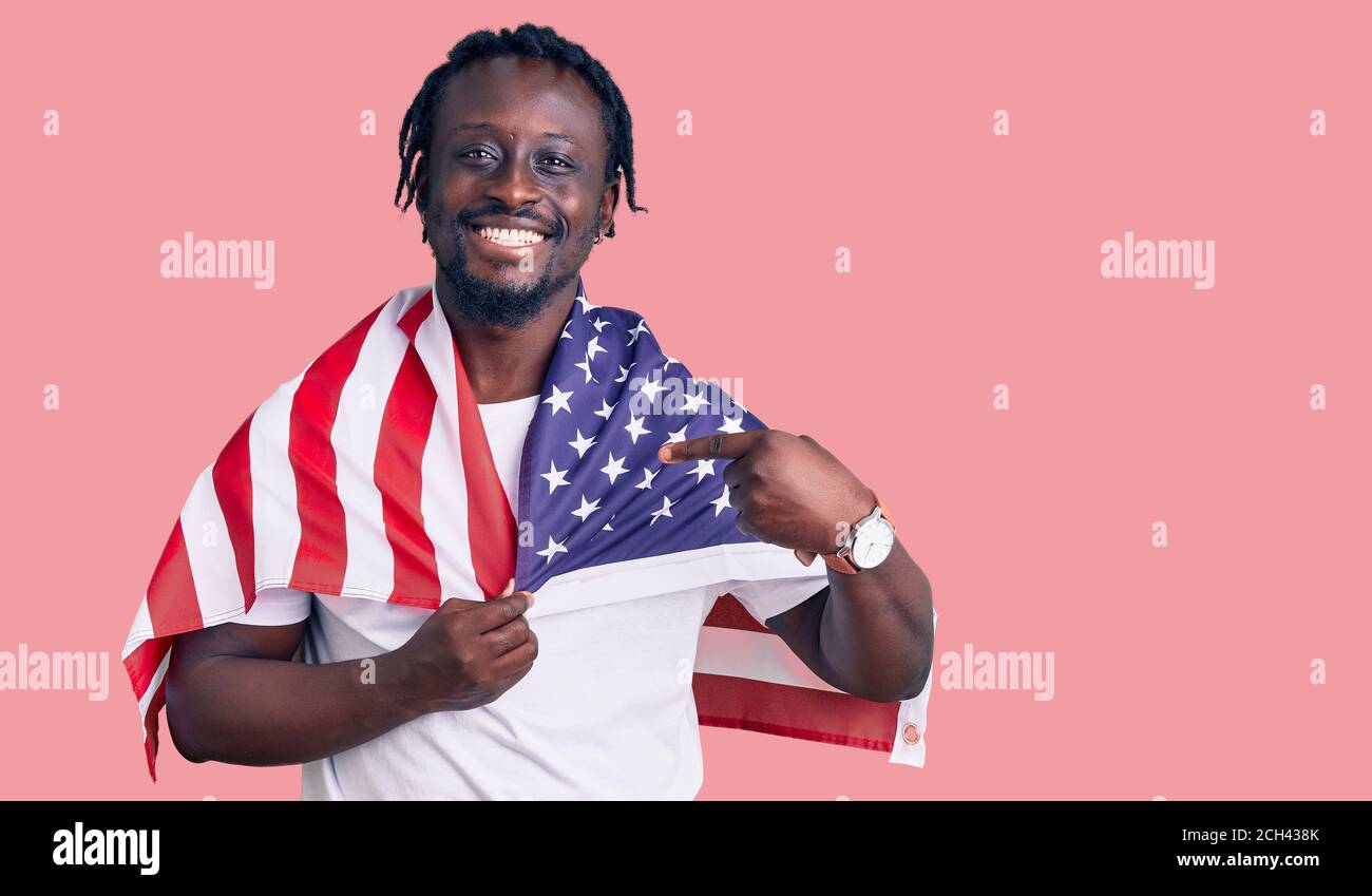 Young african american man with braids wearing united states flag ...
