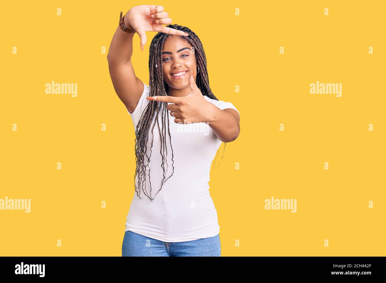 Young african american woman with braids wearing casual clothes smiling ...
