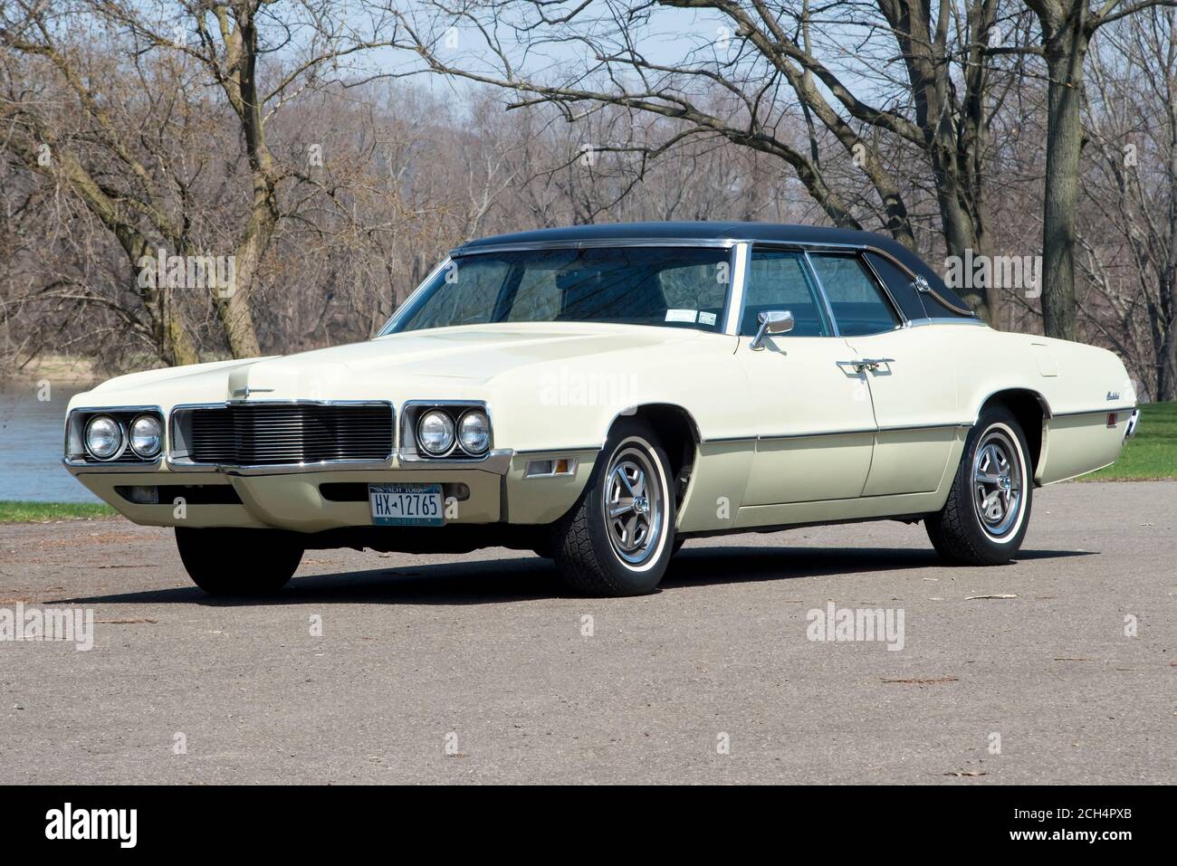 1970 Thunderbird Landau sedan front three-quarter view in park along river Stock Photo