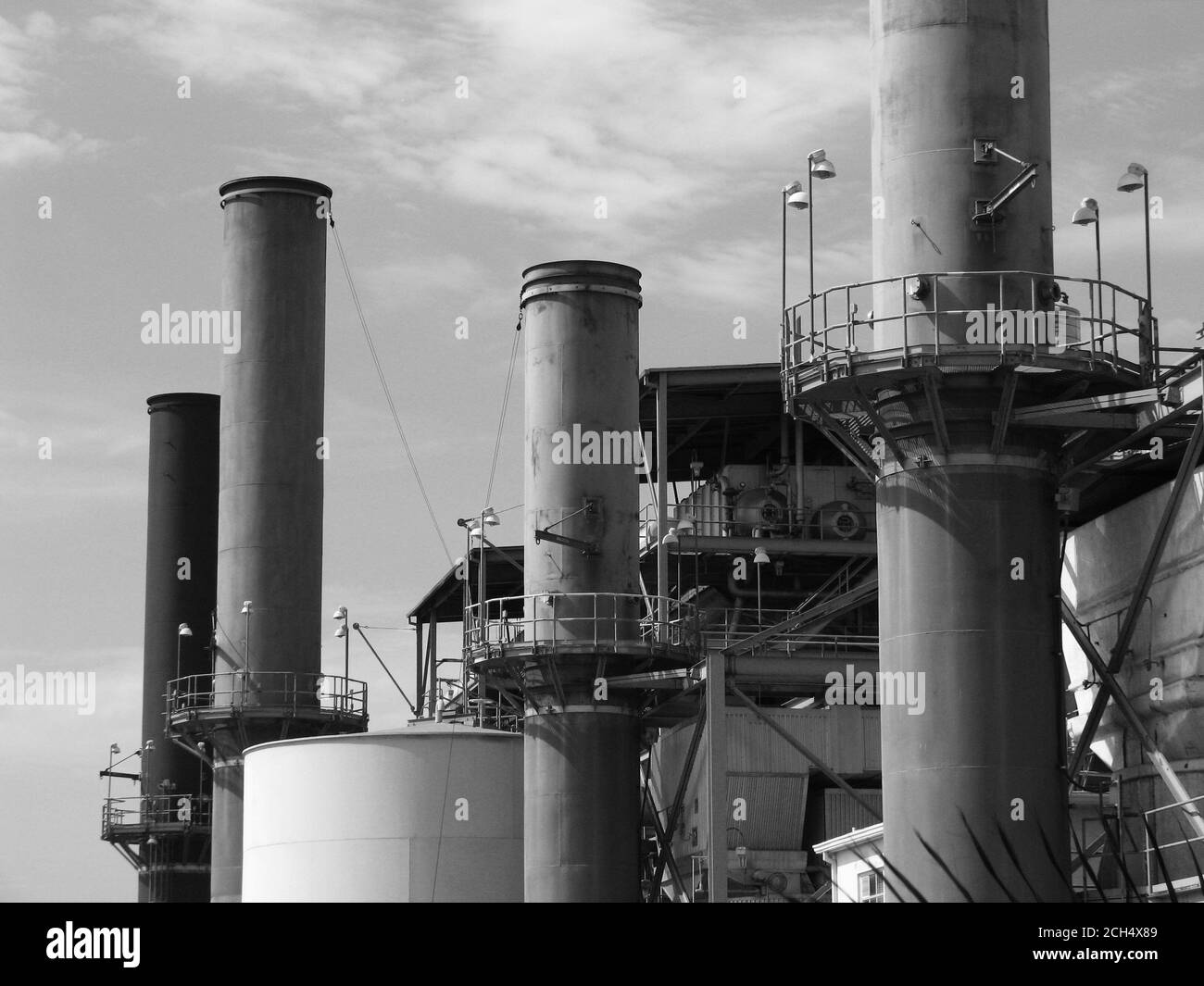 Grand Terrace, California, USA - July 2007:  Archival black and white view of smoke stacks at the now demolished Grand Terrace power plant in Southern California. Stock Photo