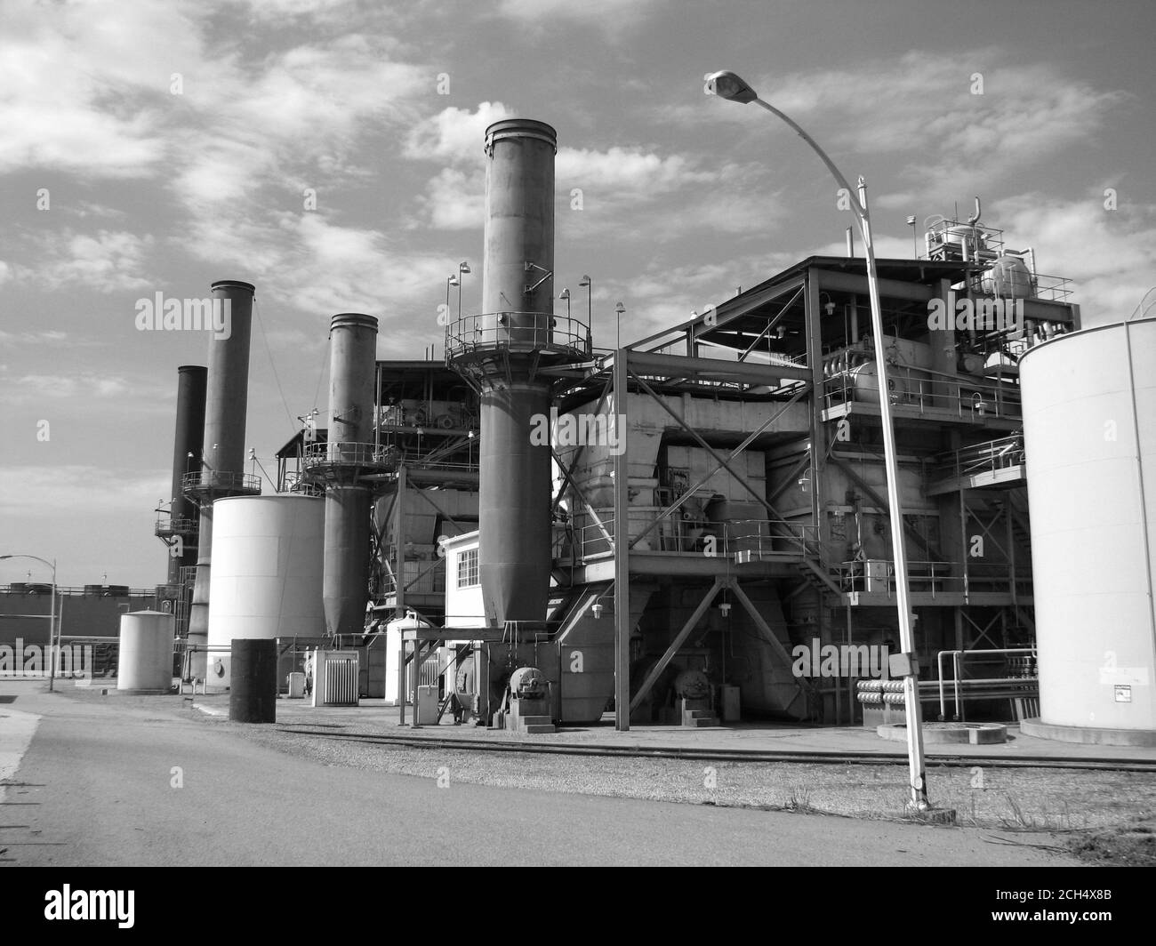 Grand Terrace, California, USA - July 2007:  Archival black and white view of smoke stacks and structures at the now demolished Grand Terrace power plant in Southern California. Stock Photo