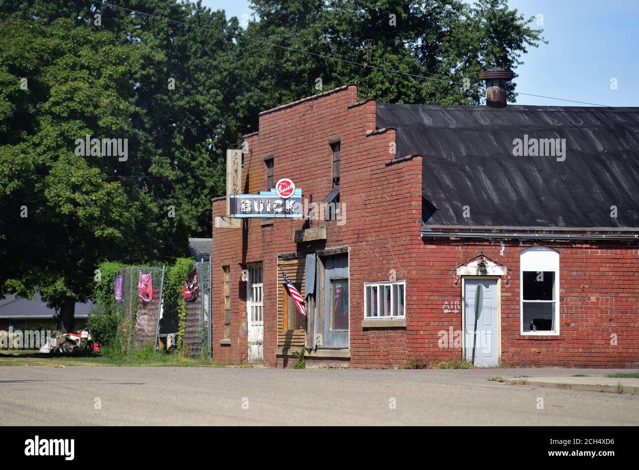 Varna, Illinois, USA. Some old neon signs and an American flag are