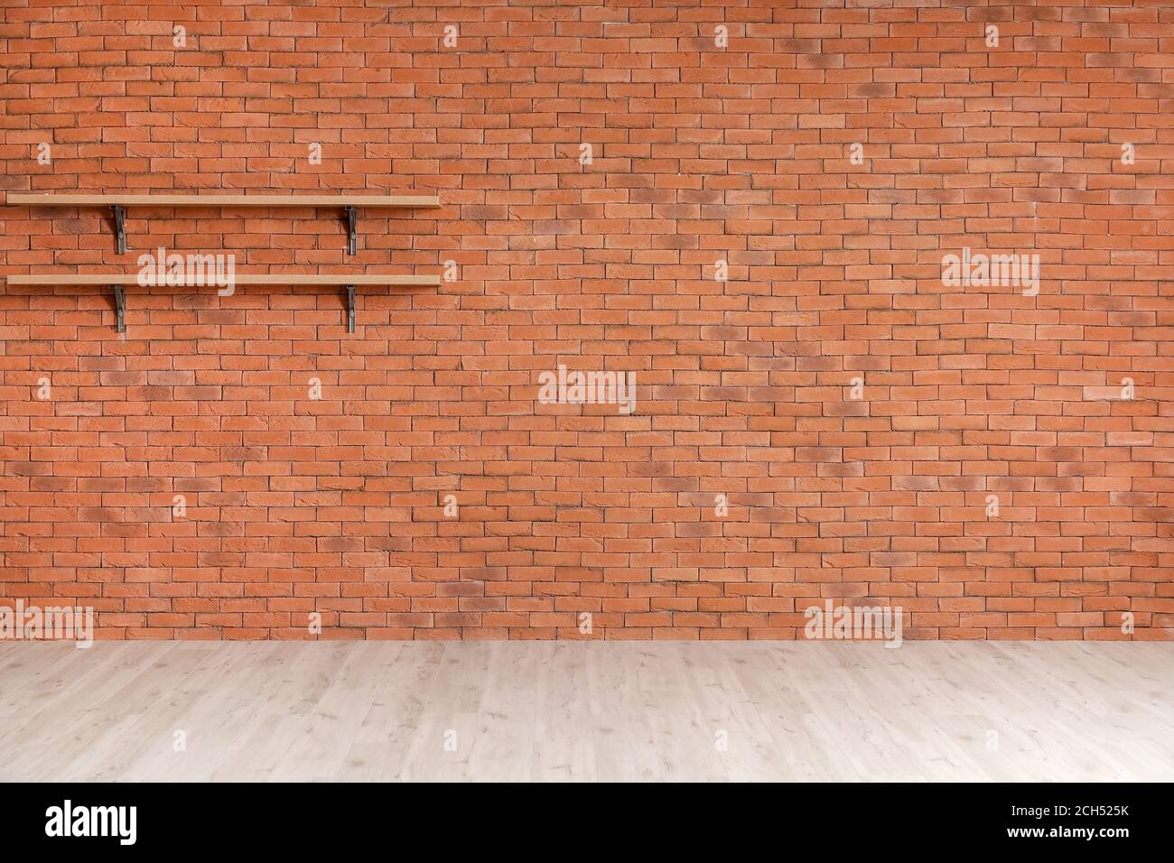 Empty shelves hanging on brick wall Stock Photo Alamy