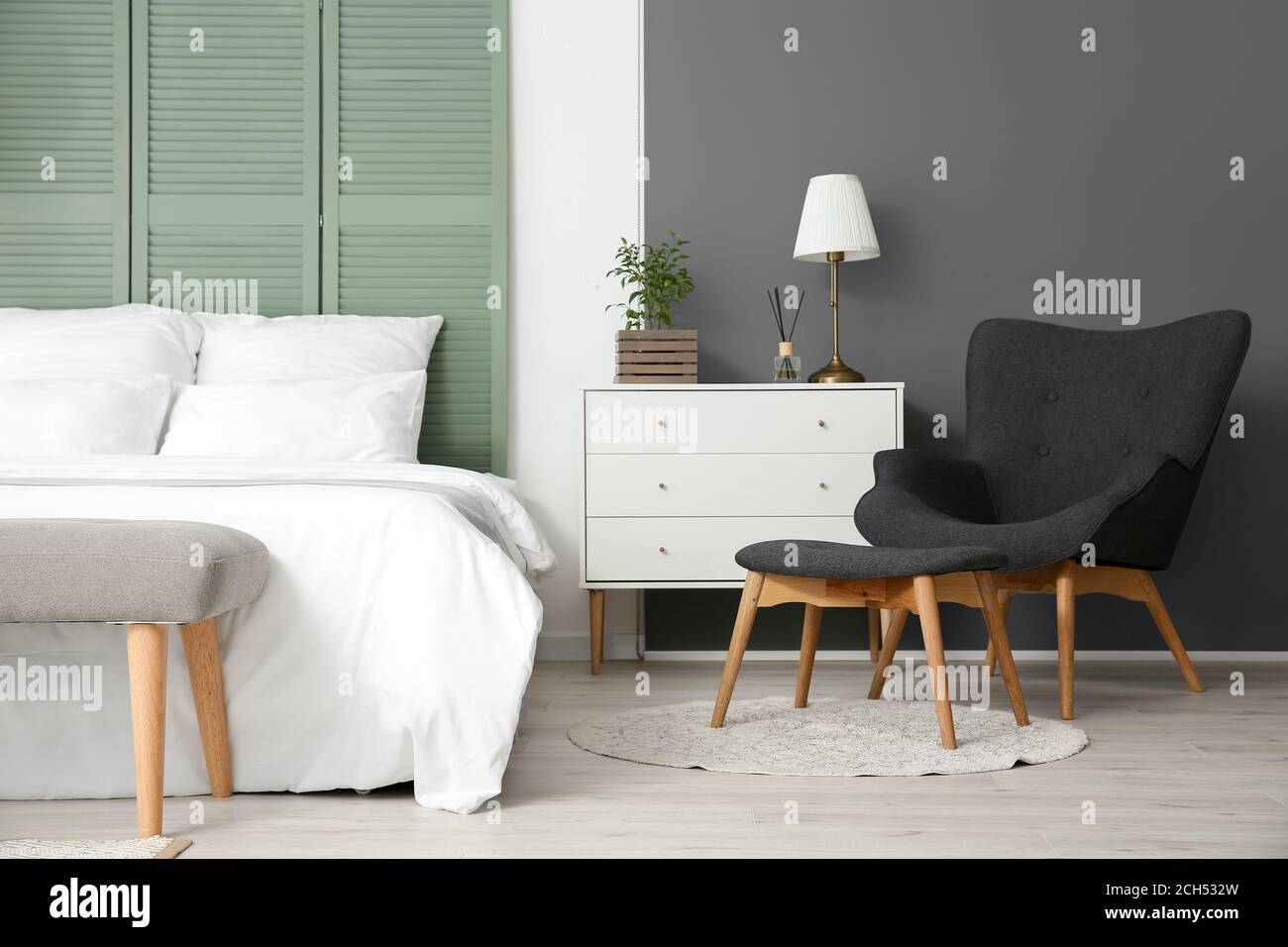 Interior of modern stylish room with armchair Stock Photo - Alamy