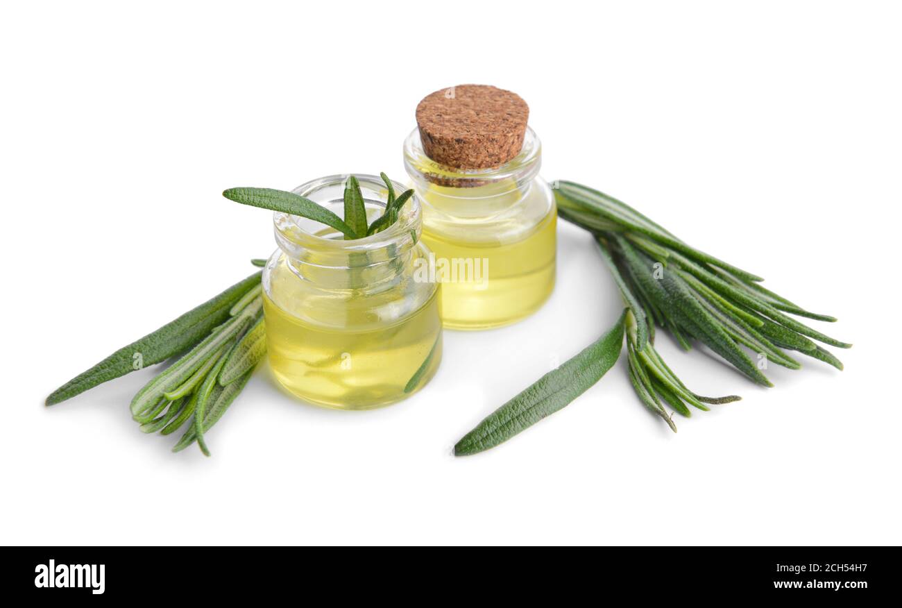 Bottles of rosemary essential oil on white background Stock Photo - Alamy