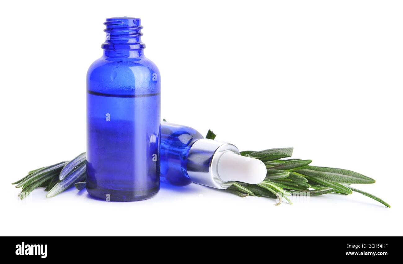 Bottles of rosemary essential oil on white background Stock Photo - Alamy
