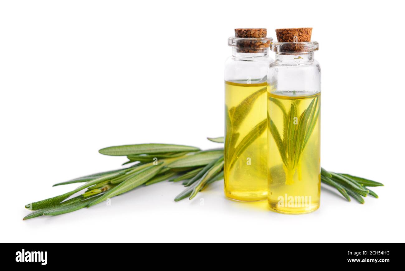 Bottles of rosemary essential oil on white background Stock Photo - Alamy