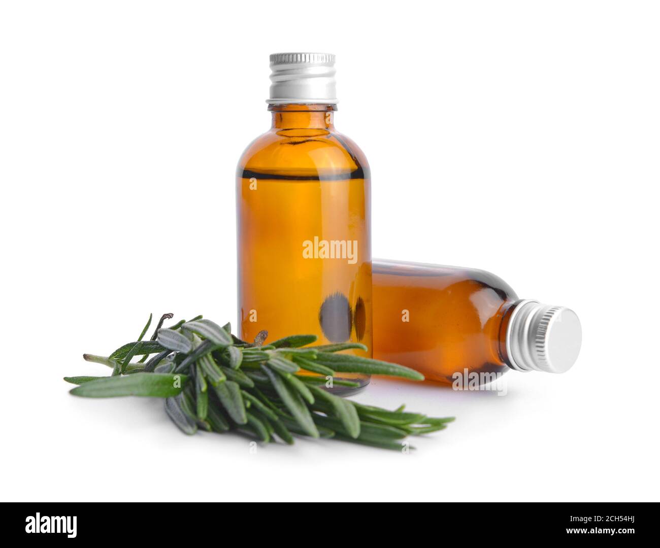 Bottles of rosemary essential oil on white background Stock Photo - Alamy