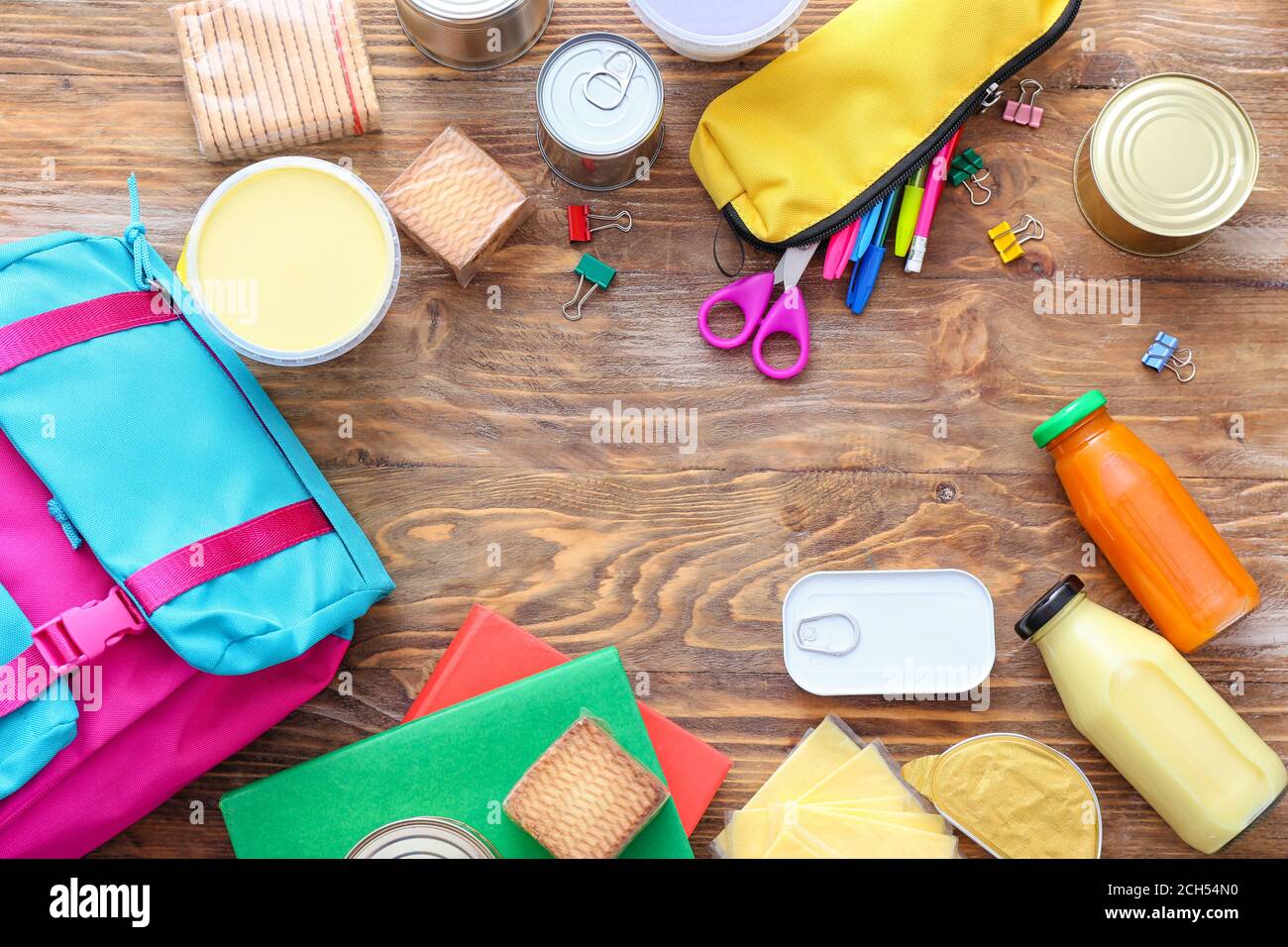 Schoolbag with different products on table. Concept of Backpack Food ...