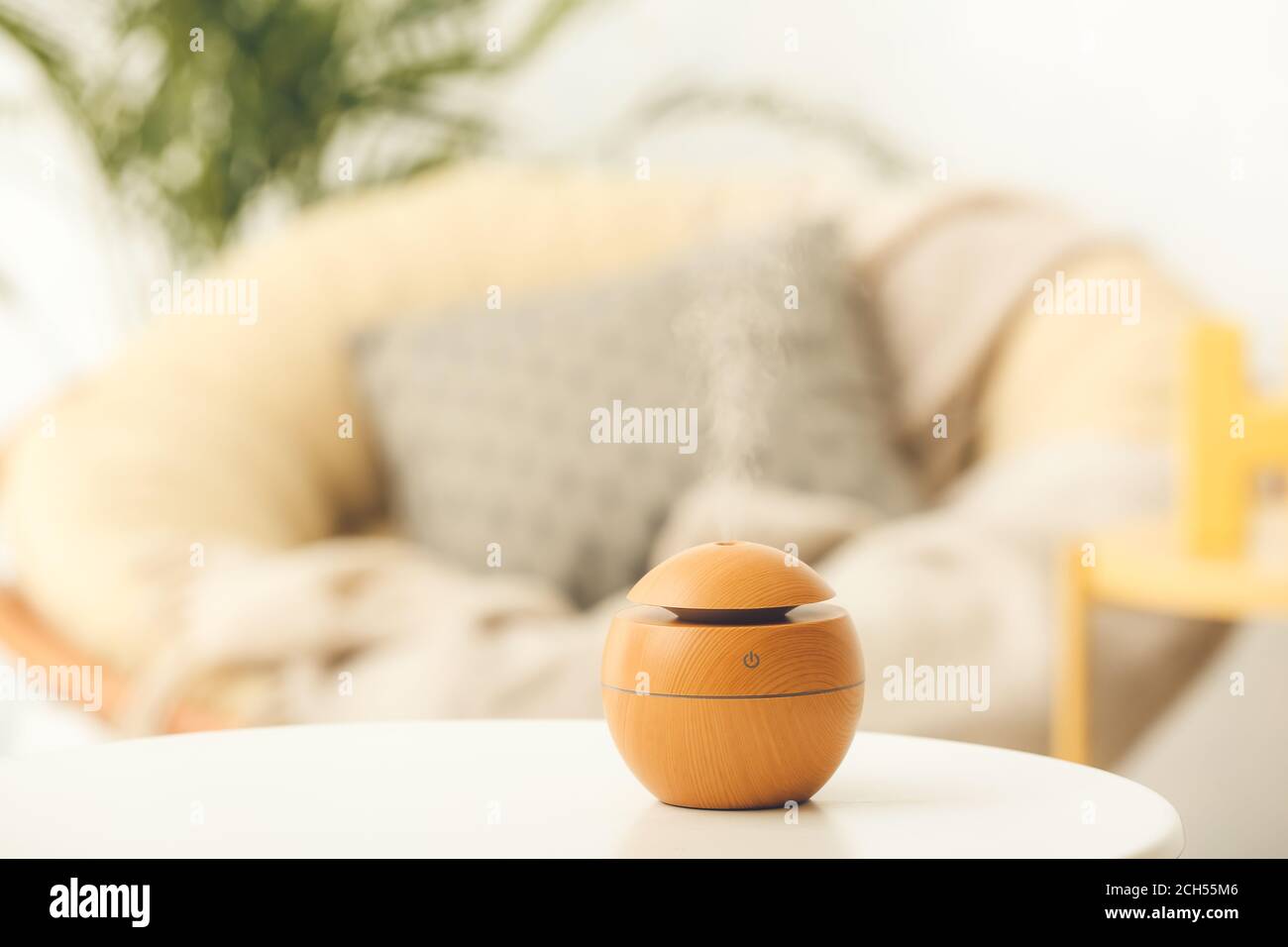 Aroma oil diffuser on table in room Stock Photo - Alamy