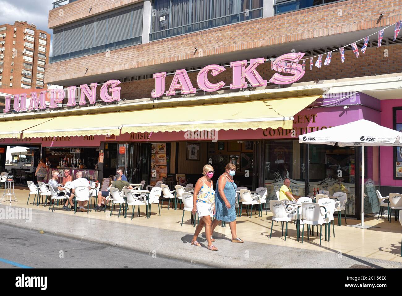 Benidorm, Spain. 09th Sep, 2020. Women wearing face masks walk past Jumping Jack's Bar amid Coronavirus (COVID-19) crisis.When Spain locked down to slow the coronavirus in March, about 25,000 British tourists were enjoying the beaches and bars of the Costa Blanca resort of Benidorm. Local officials quickly ordered hotels to shut their doors, and as the visitors packed their bags and flocked to the airport, the town's tourism industry-its lifeblood-went into hibernation along with the rest of the country. Credit: SOPA Images Limited/Alamy Live News Stock Photo
