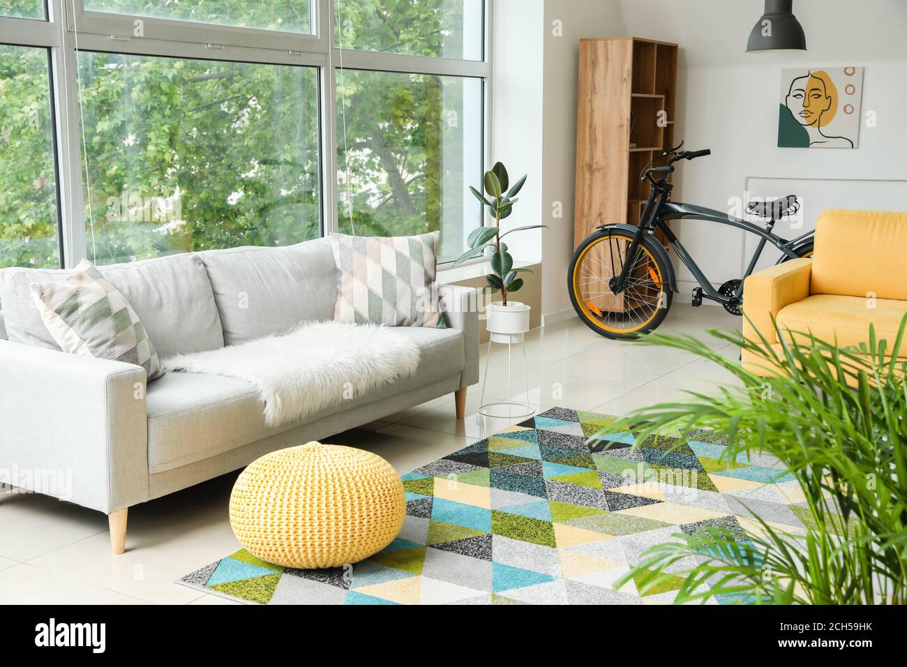 Stylish interior of living room with comfortable sofa Stock Photo - Alamy