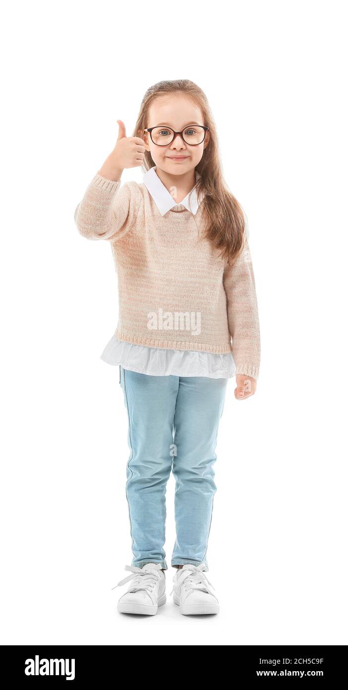 Cute little girl showing thumb-up on white background Stock Photo - Alamy