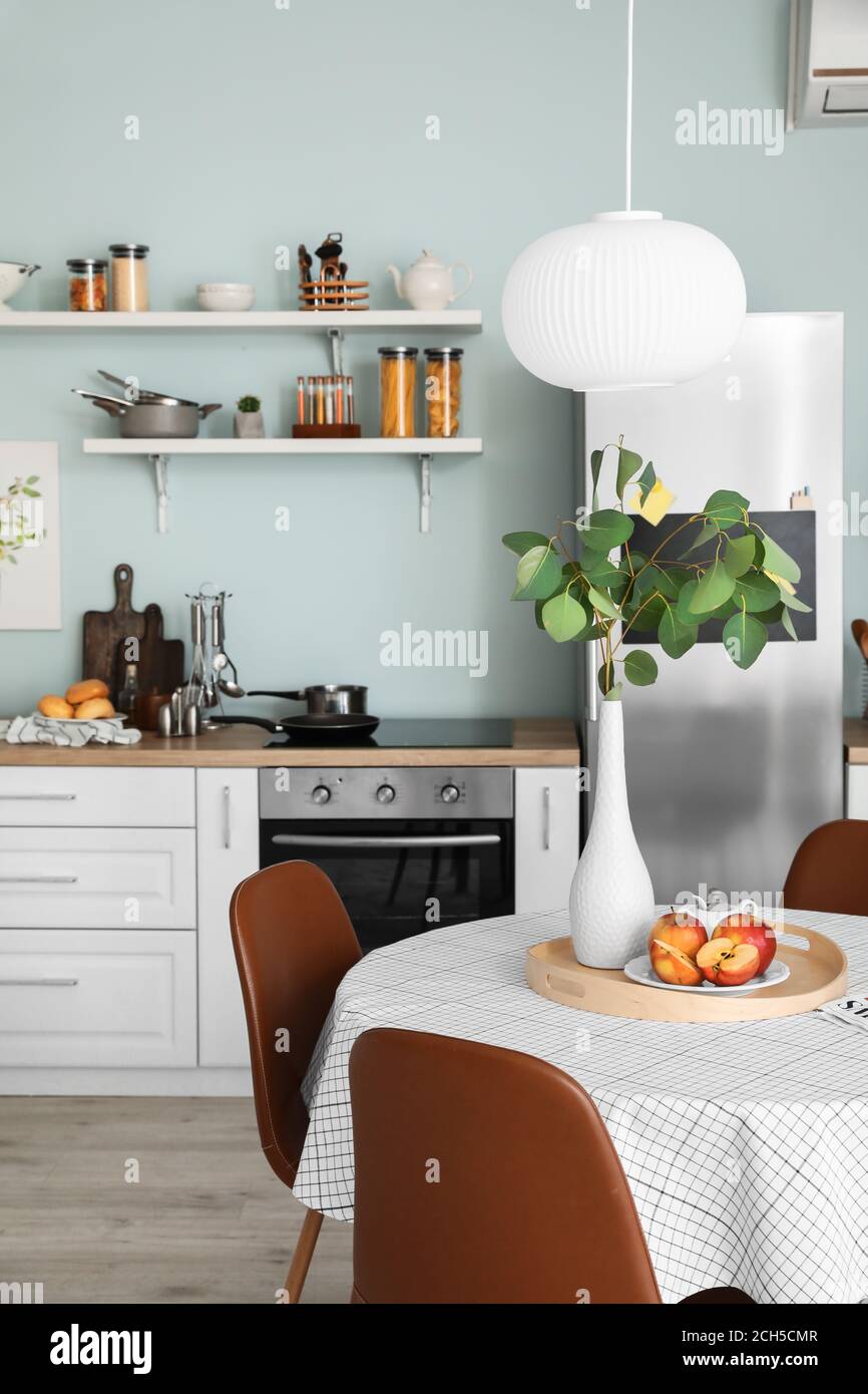 Interior of stylish modern kitchen with dining table Stock Photo - Alamy