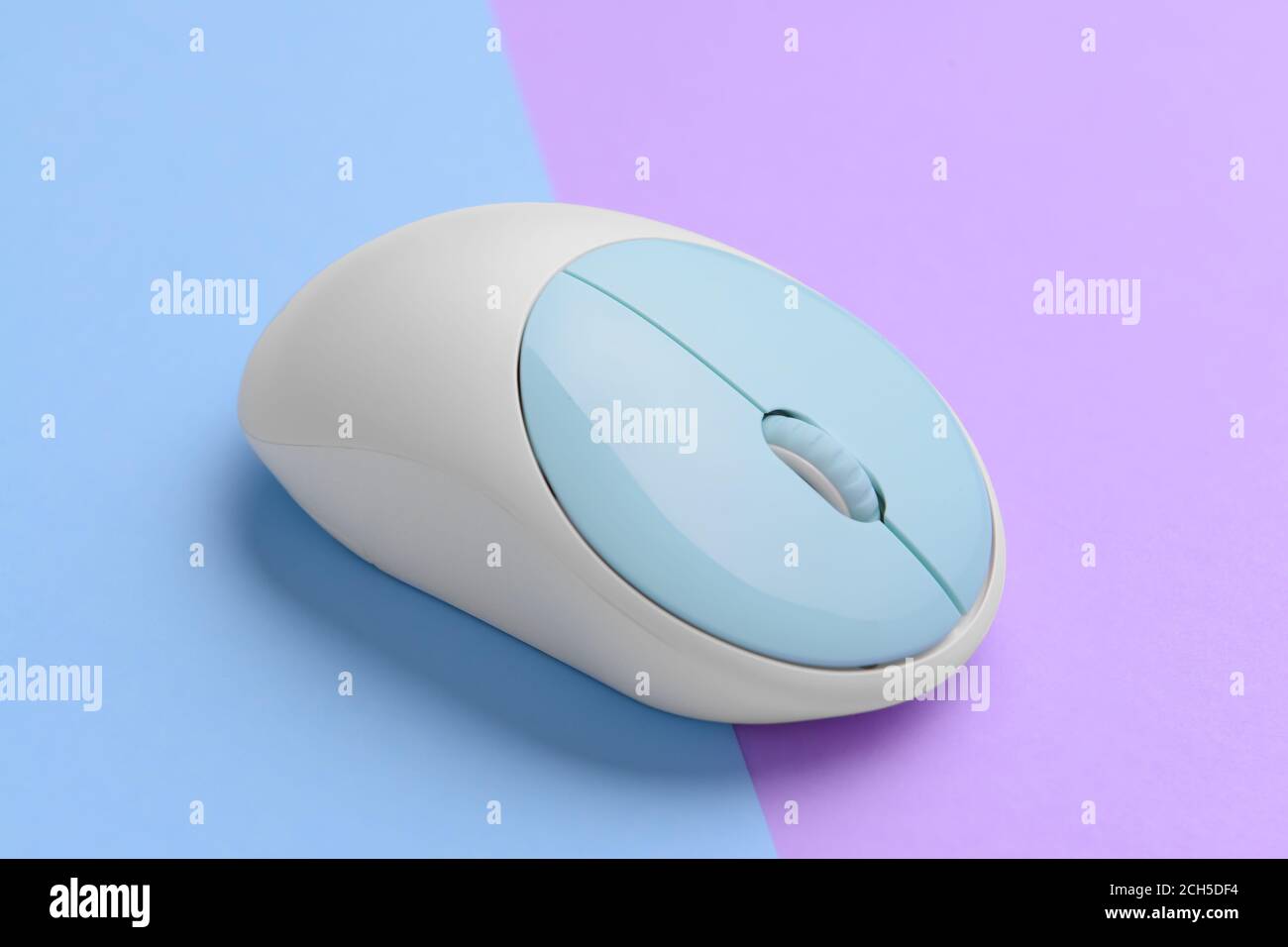 Modern computer mouse on color background Stock Photo - Alamy
