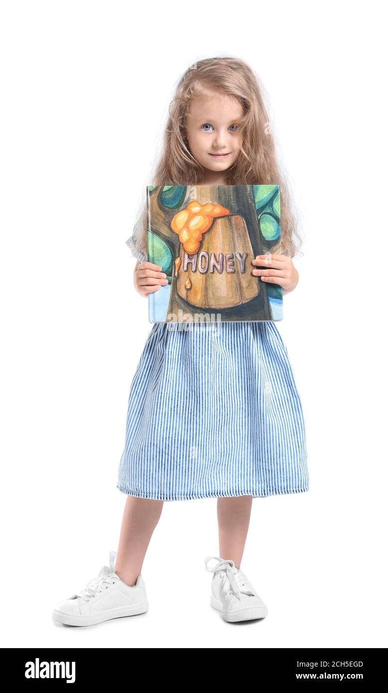 Cute little girl with book on white background Stock Photo - Alamy
