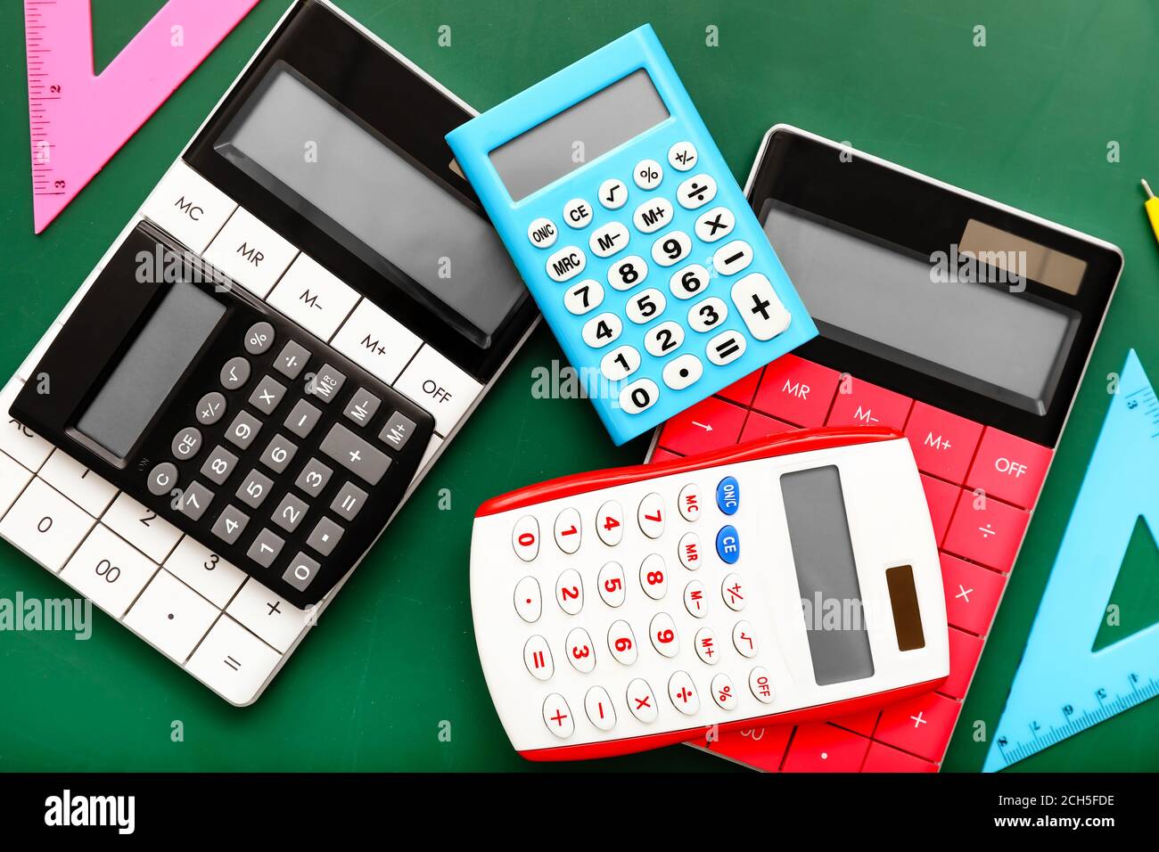 Modern calculators and rulers on color background Stock Photo Alamy