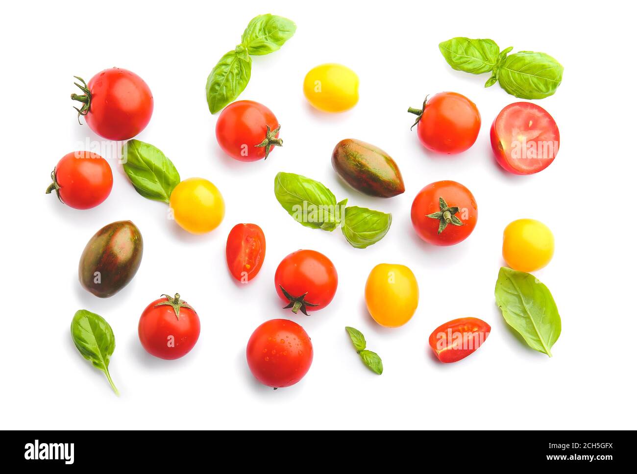 Fresh cherry tomatoes and basil on white background Stock Photo - Alamy