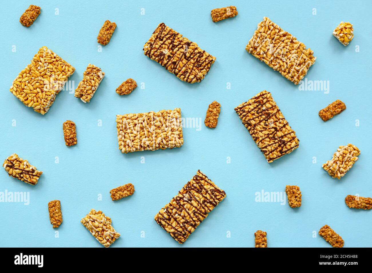 Crispy rice bars on color background Stock Photo - Alamy
