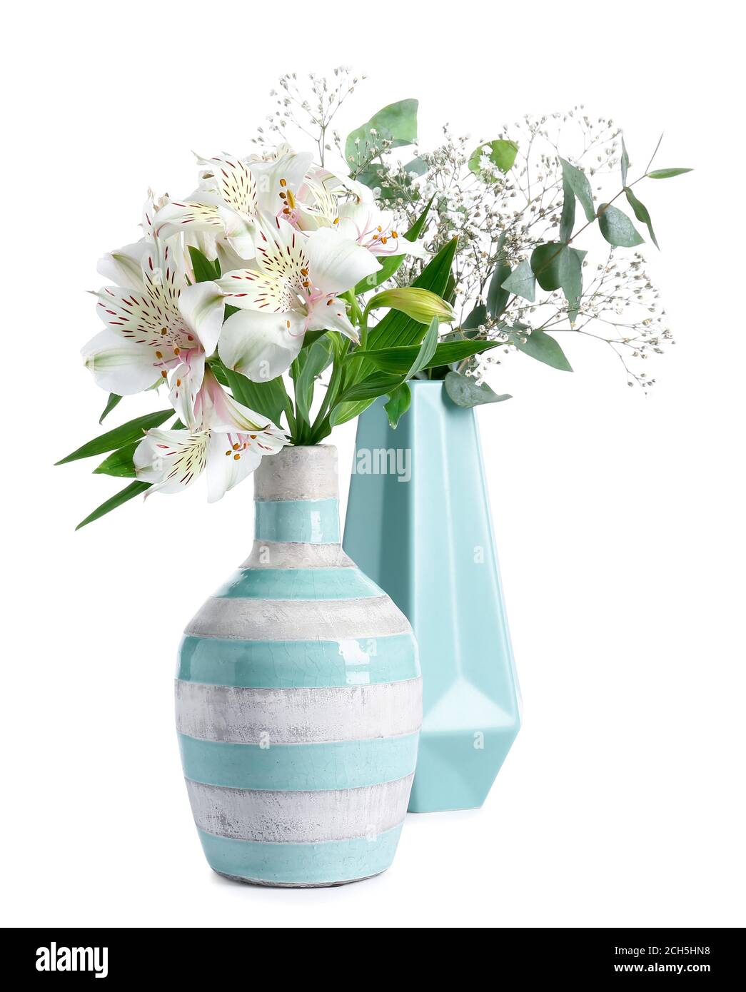 Beautiful vases with flowers on white background Stock Photo - Alamy