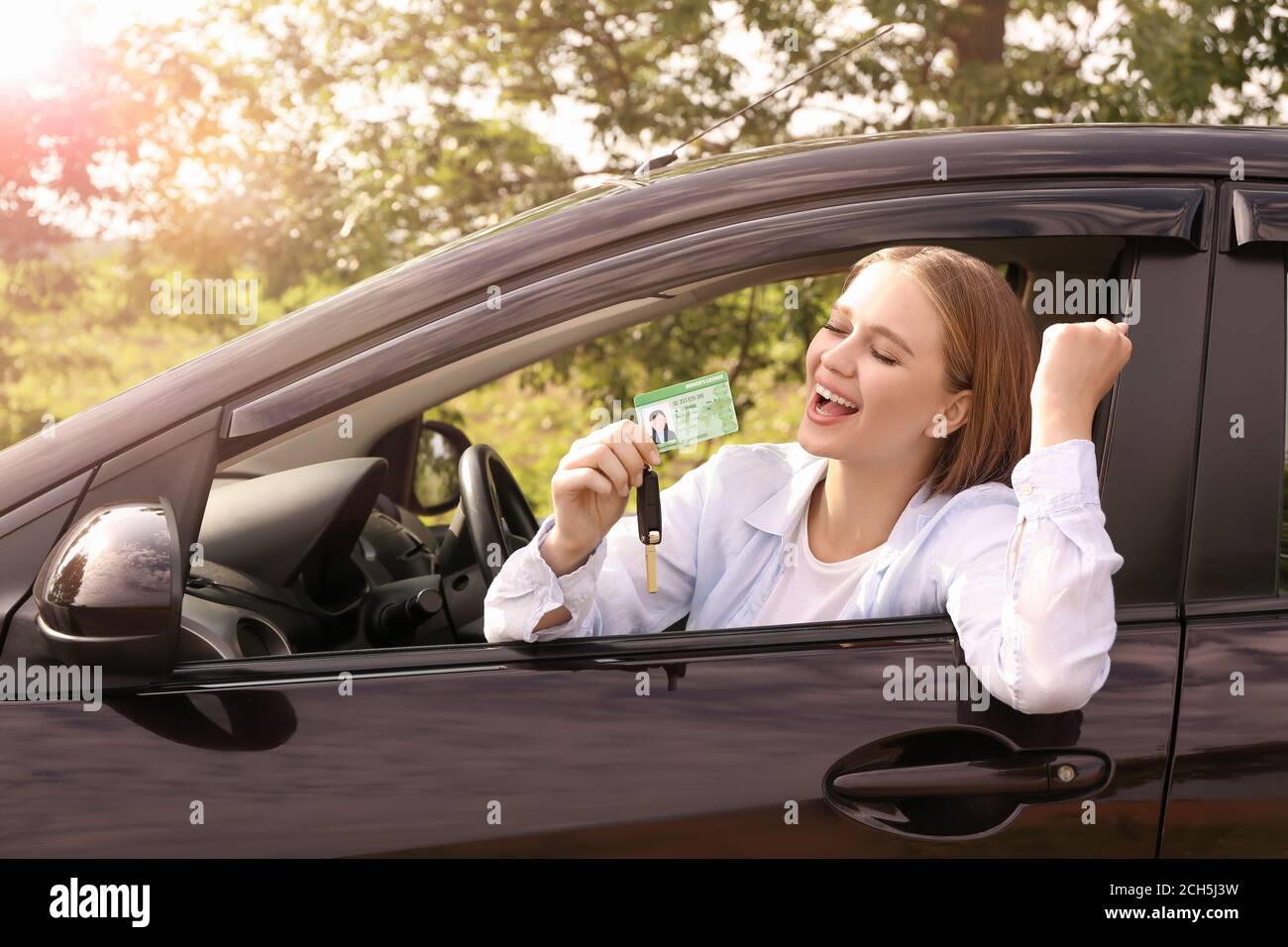 happy-young-woman-after-successful-passing-of-driving-license-test