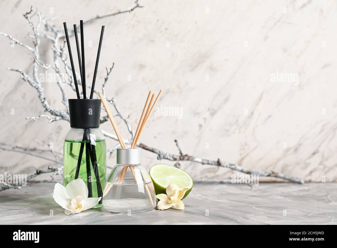 Different reed diffusers on table Stock Photo