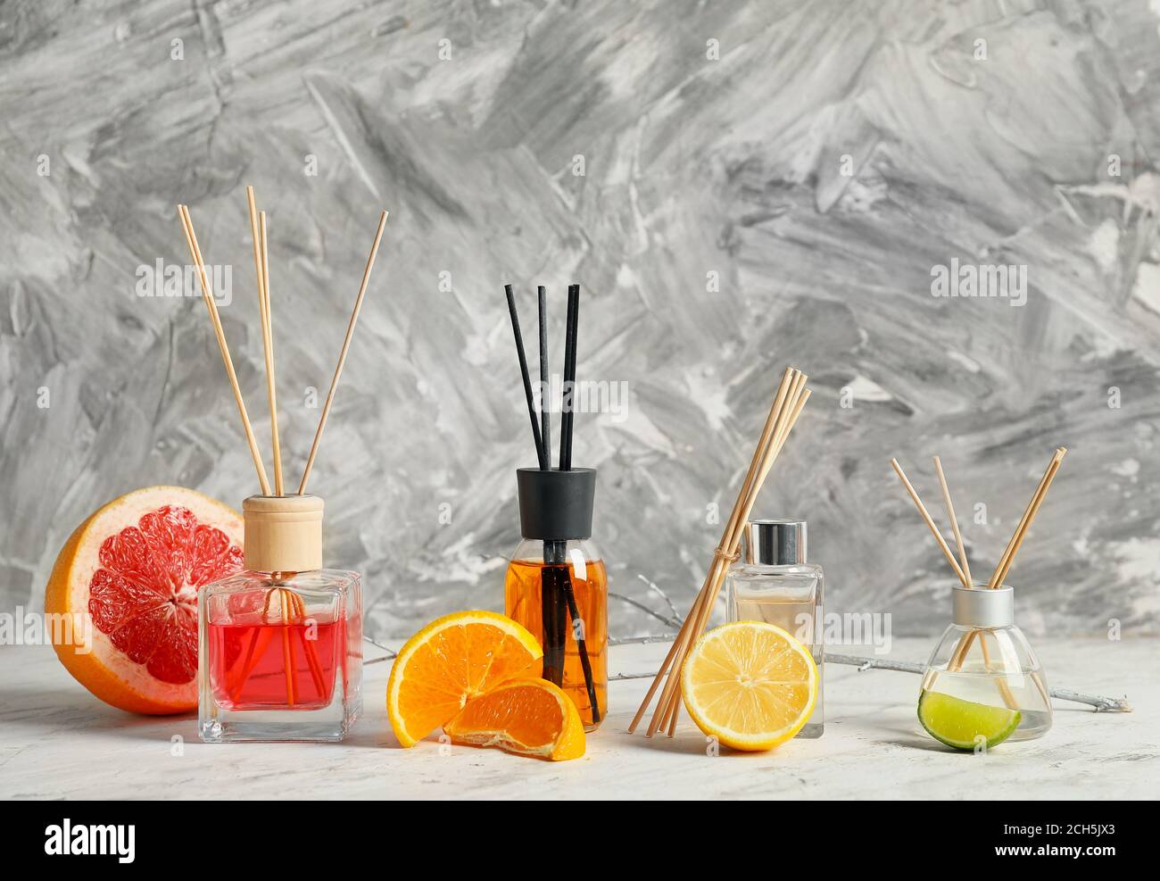 Different reed diffusers on table Stock Photo