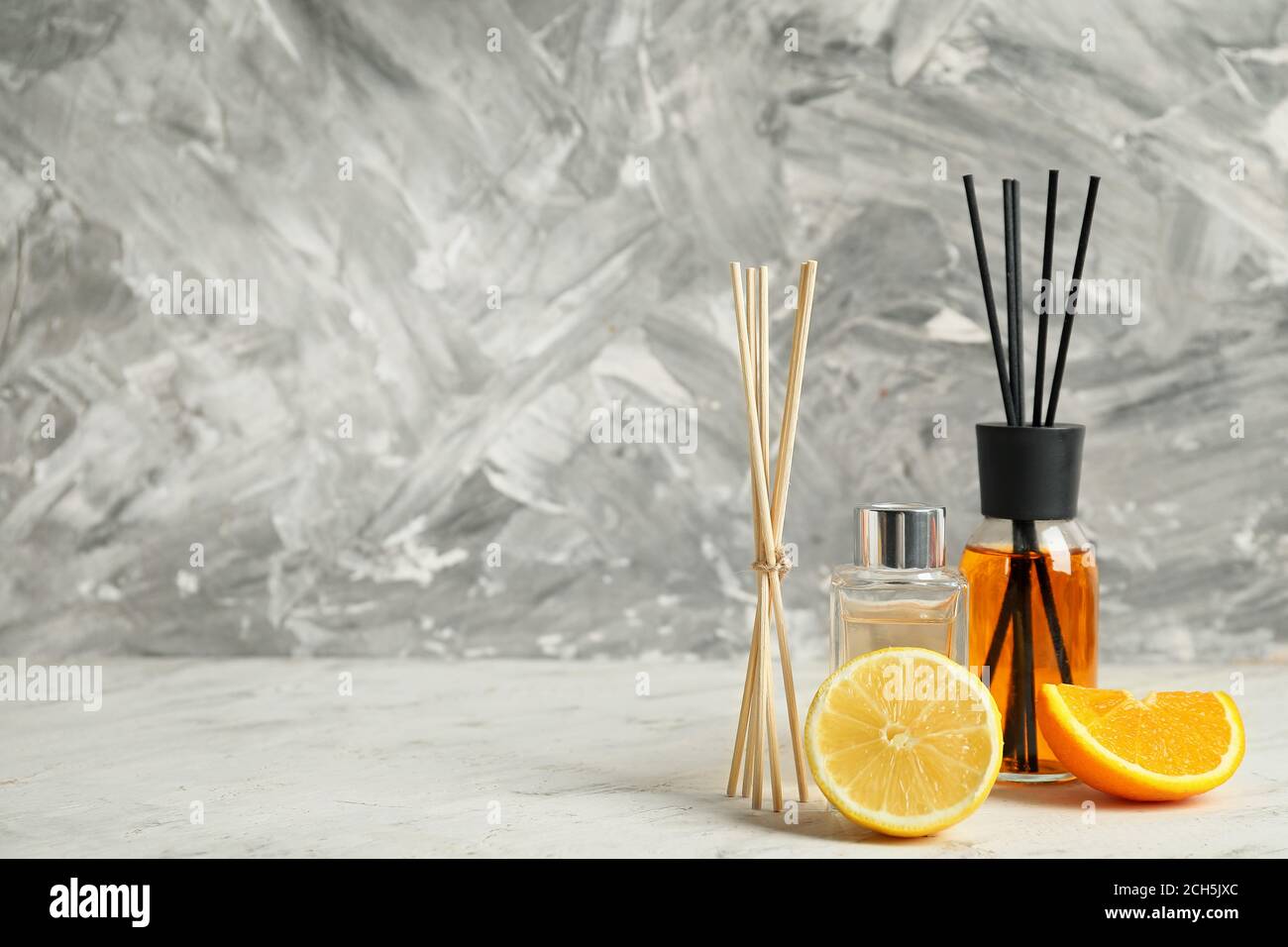 Different reed diffusers on table Stock Photo