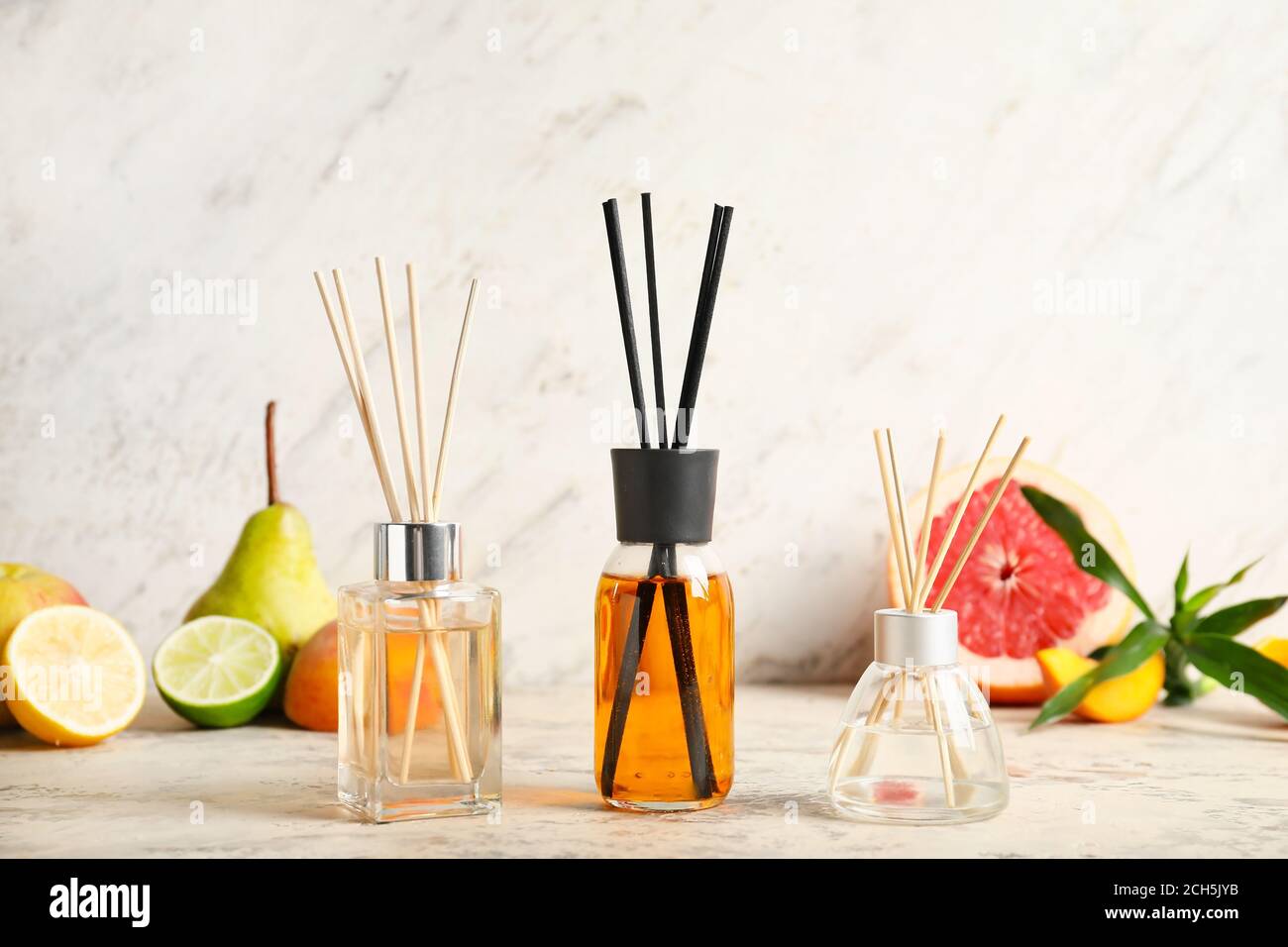Different reed diffusers on table Stock Photo
