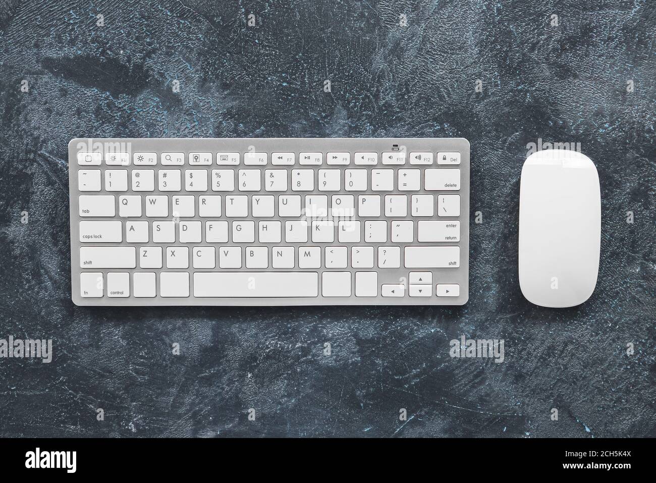 Modern PC mouse and keyboard on table Stock Photo - Alamy