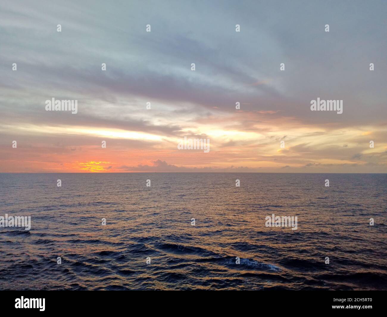 Beautiful sunset in ocean hi-res stock photography and images - Alamy