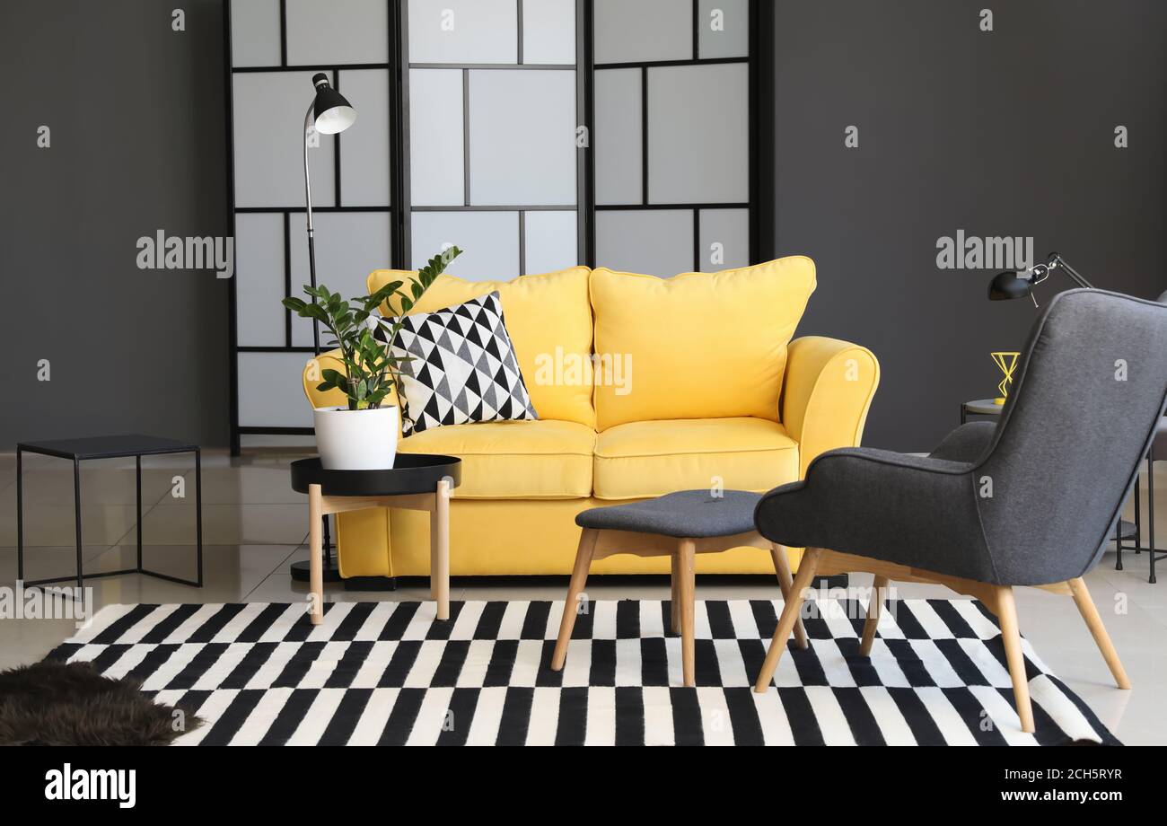 Interior of modern room with cozy sofa Stock Photo - Alamy