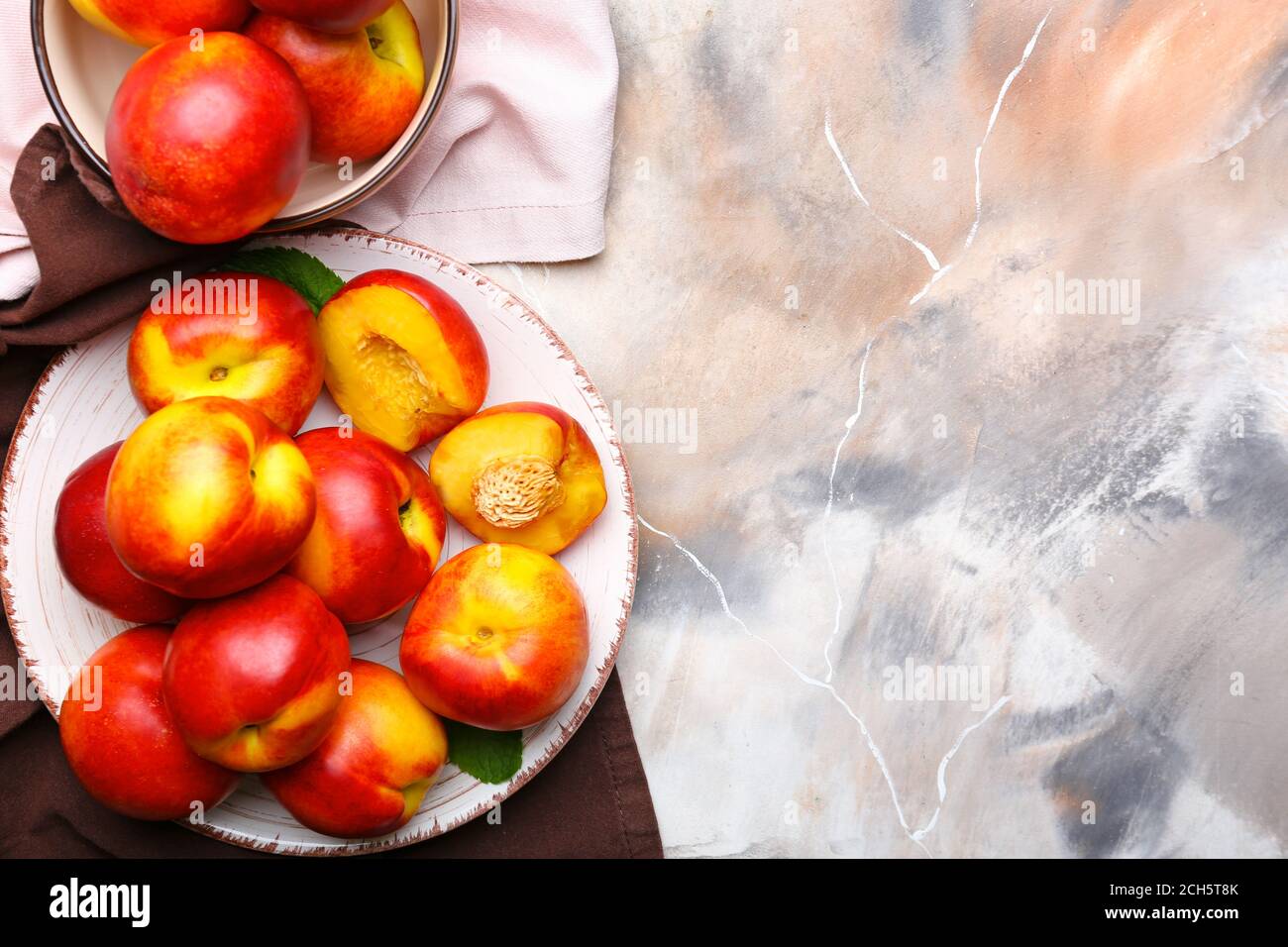 Composition with sweet ripe nectarines on table Stock Photo