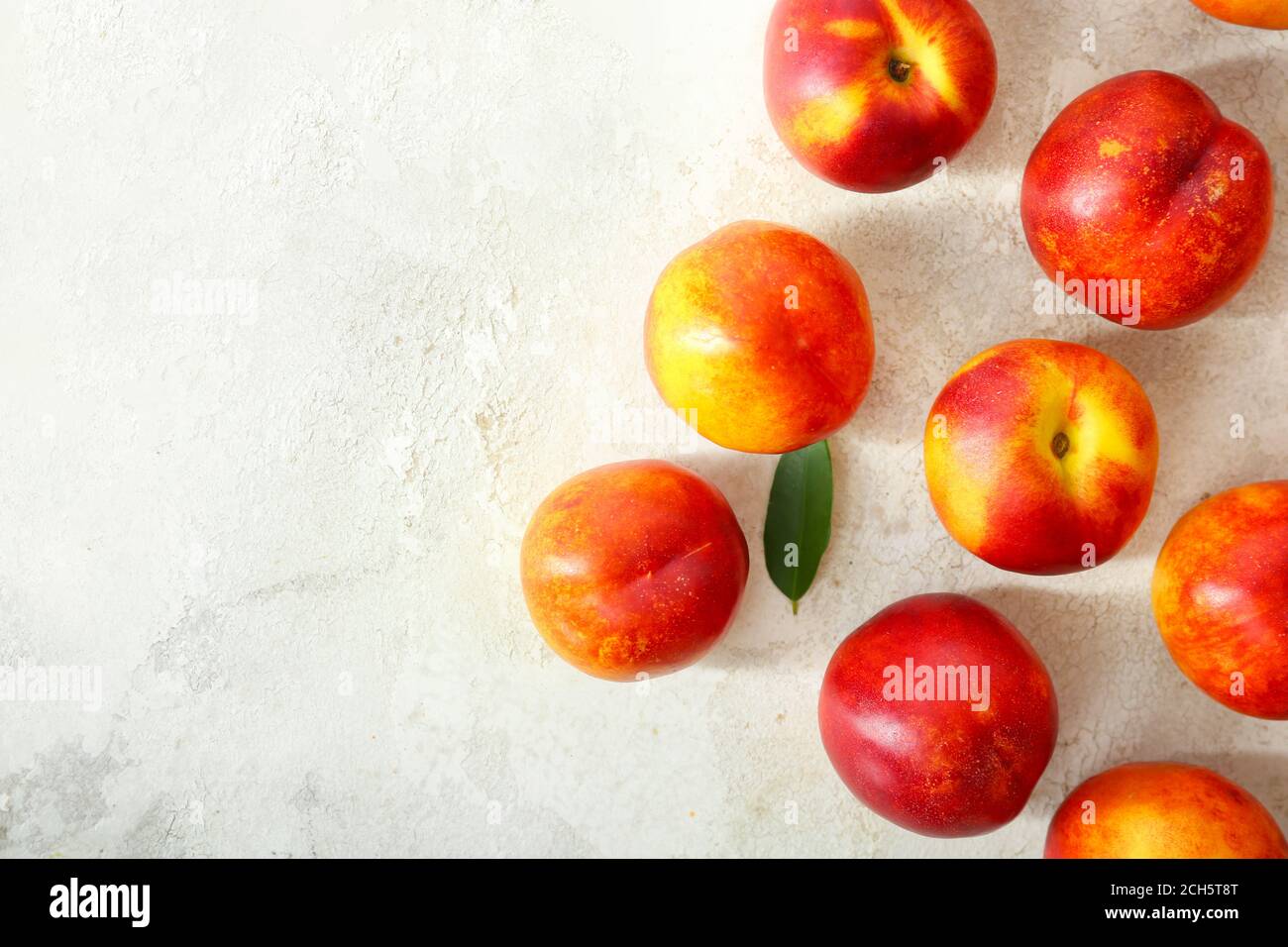 Sweet ripe nectarines on light background Stock Photo