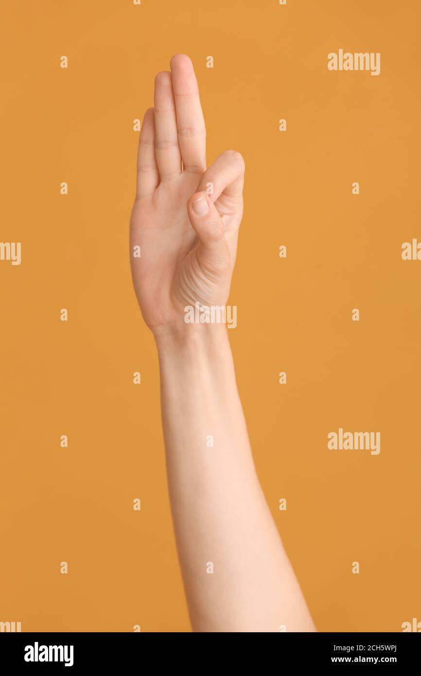 Hand showing letter F on color background. Sign language alphabet Stock ...