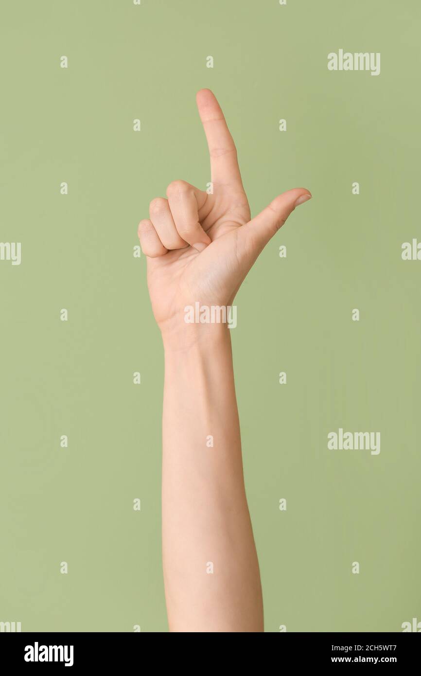 Hand showing letter L on color background. Sign language alphabet Stock ...