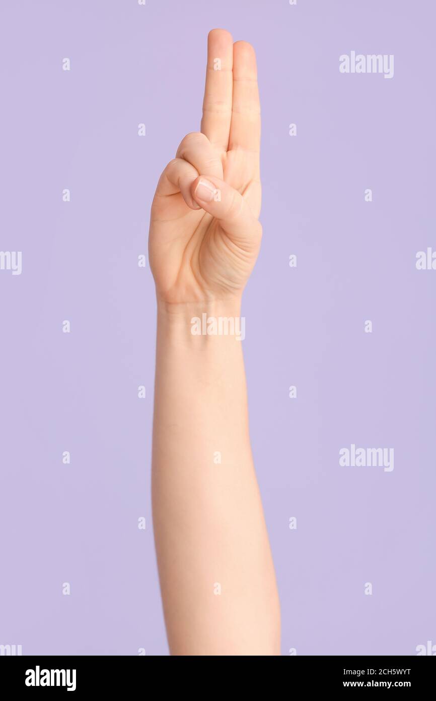 Hand showing letter U on color background. Sign language alphabet Stock ...