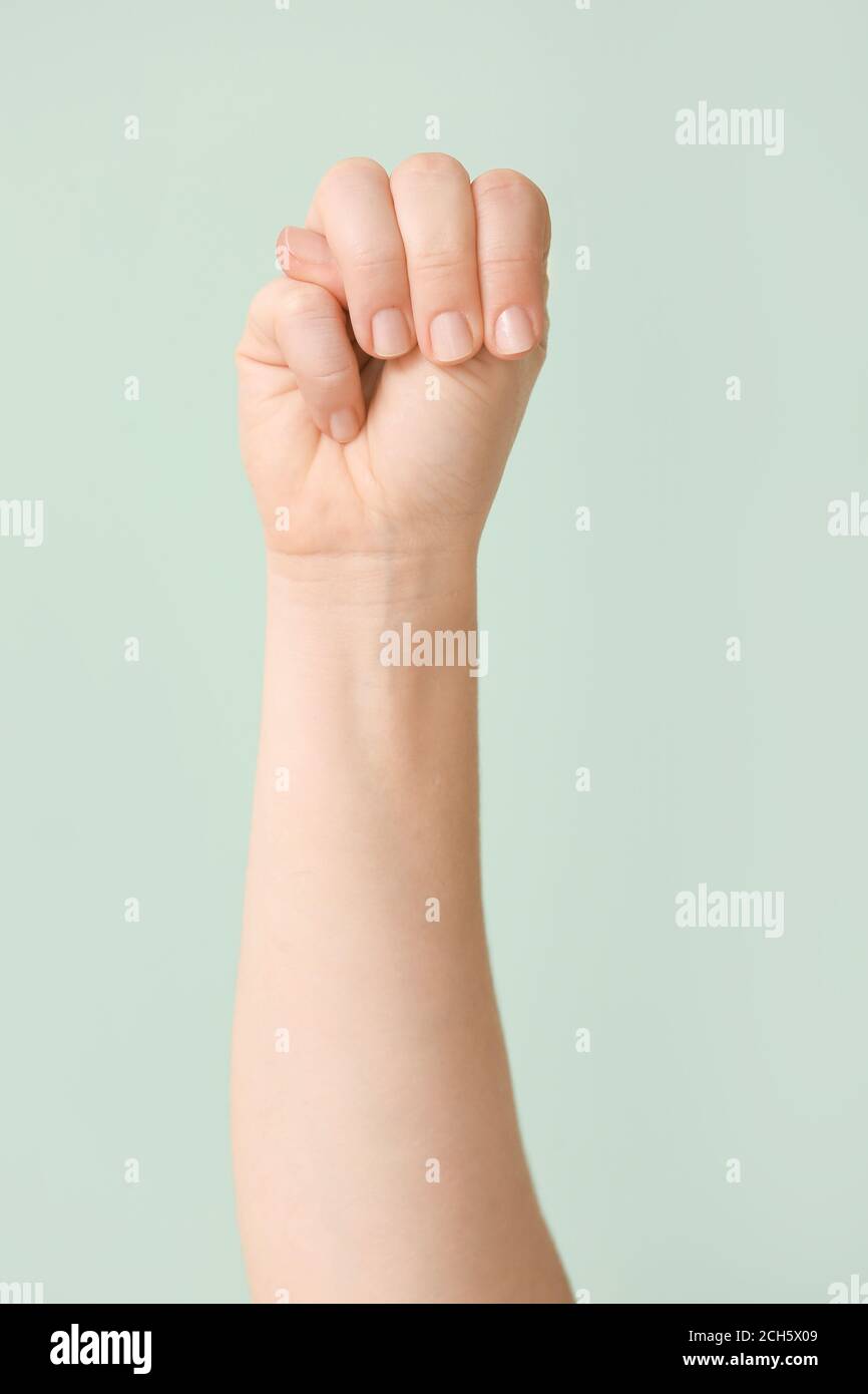 Hand showing letter M on color background. Sign language alphabet Stock ...