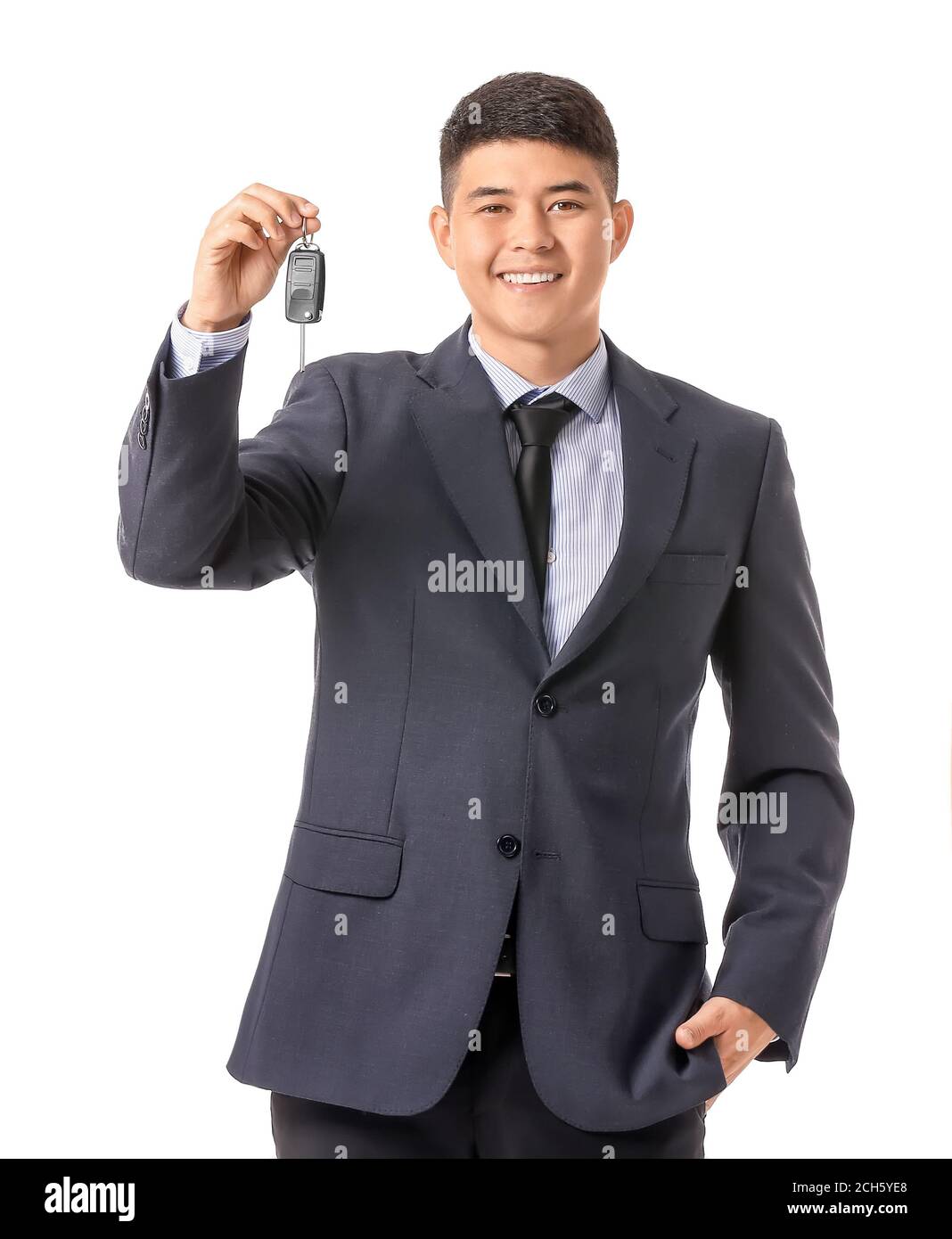 Happy Asian businessman with car key on white background Stock Photo ...