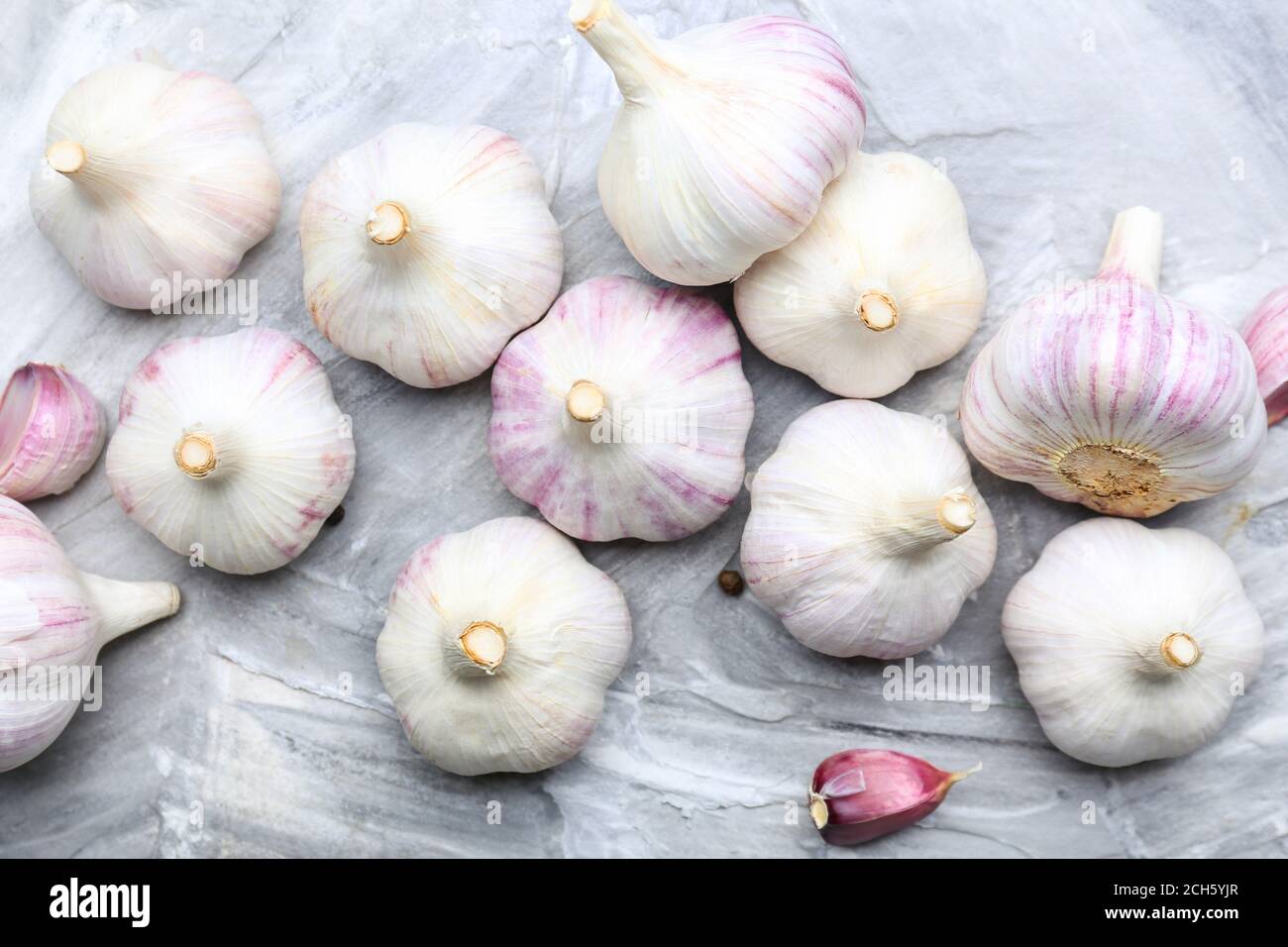 Fresh garlic on grey background Stock Photo - Alamy