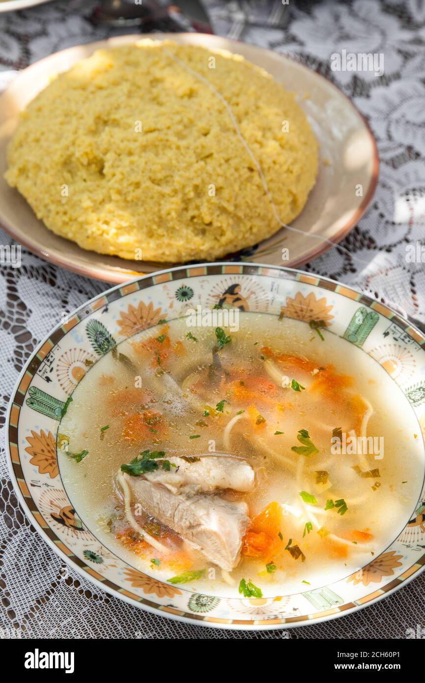 Moldovan traditional soup zama with mamaliga and selective focus Stock Photo