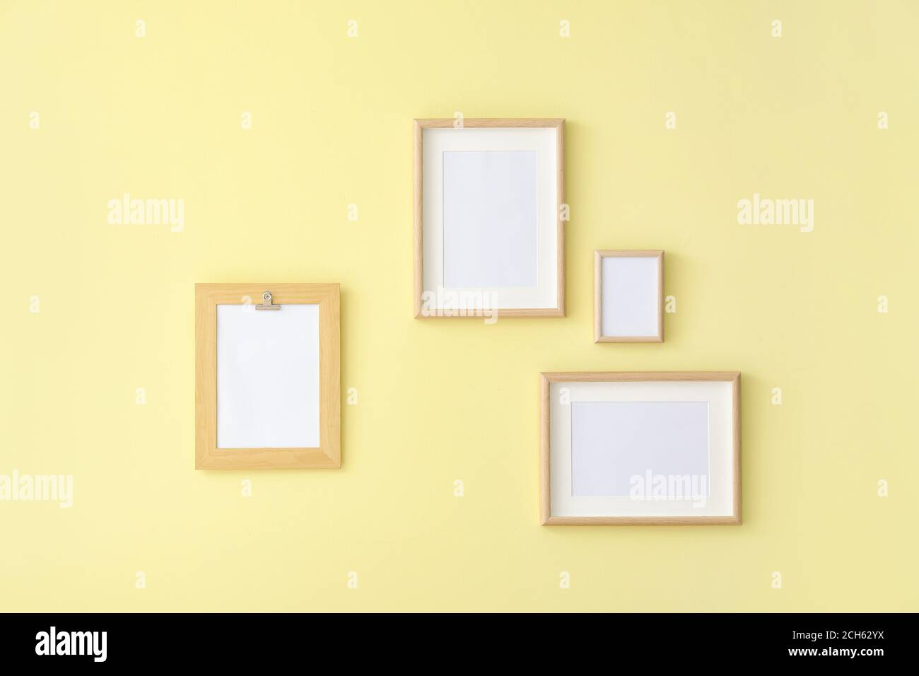 Empty photo frames hanging on wall in room Stock Photo - Alamy