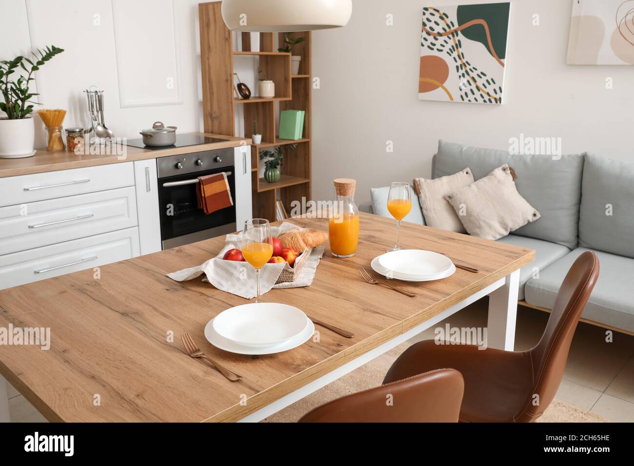 Interior of modern stylish kitchen with dining table Stock Photo - Alamy