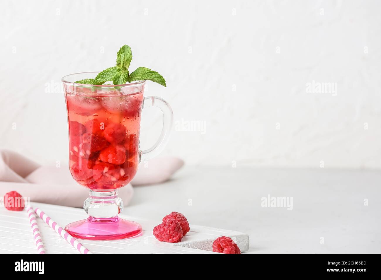 Cup of cold raspberry tea on table Stock Photo - Alamy