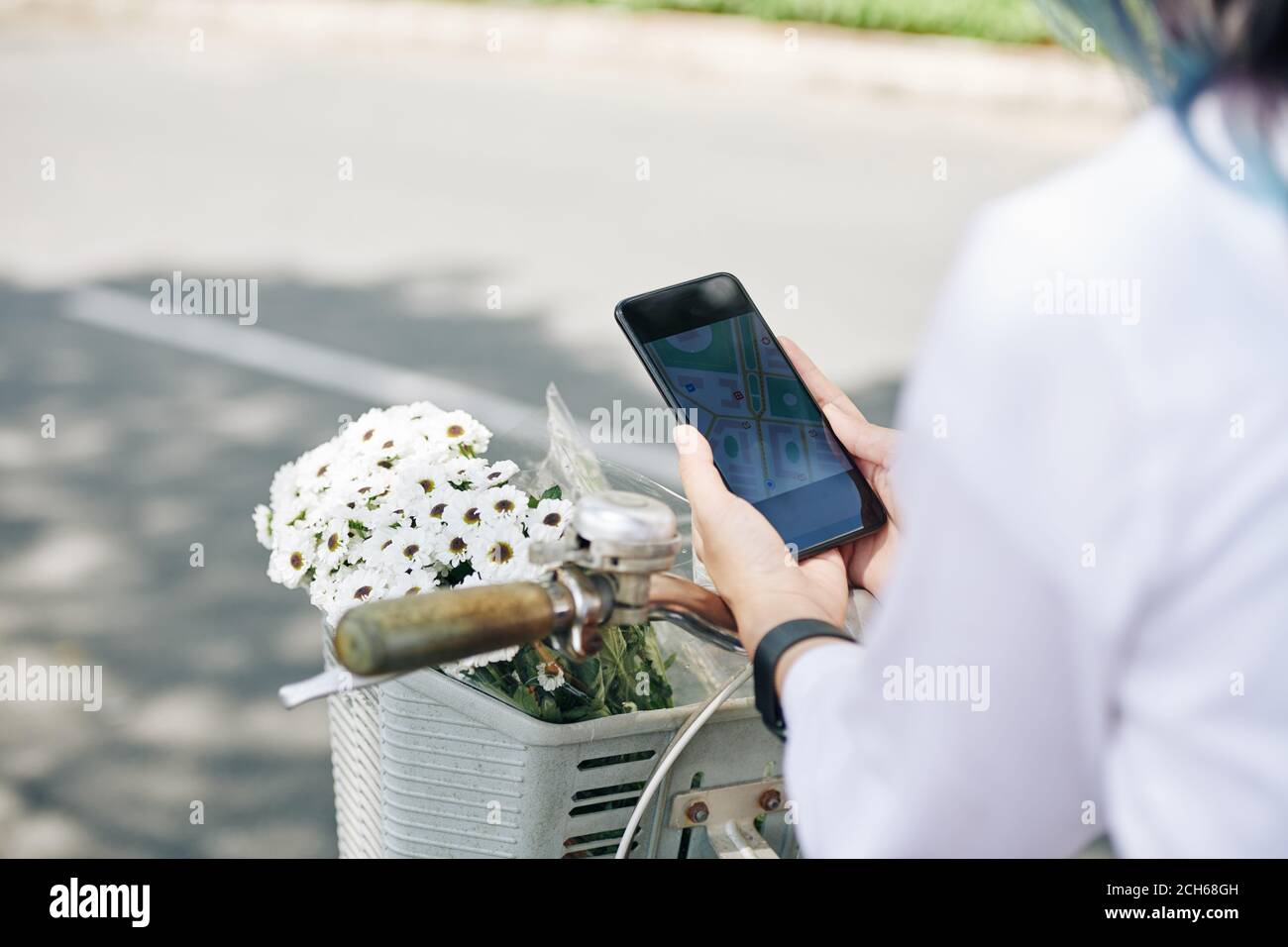 Woman checking map on smartphone Stock Photo