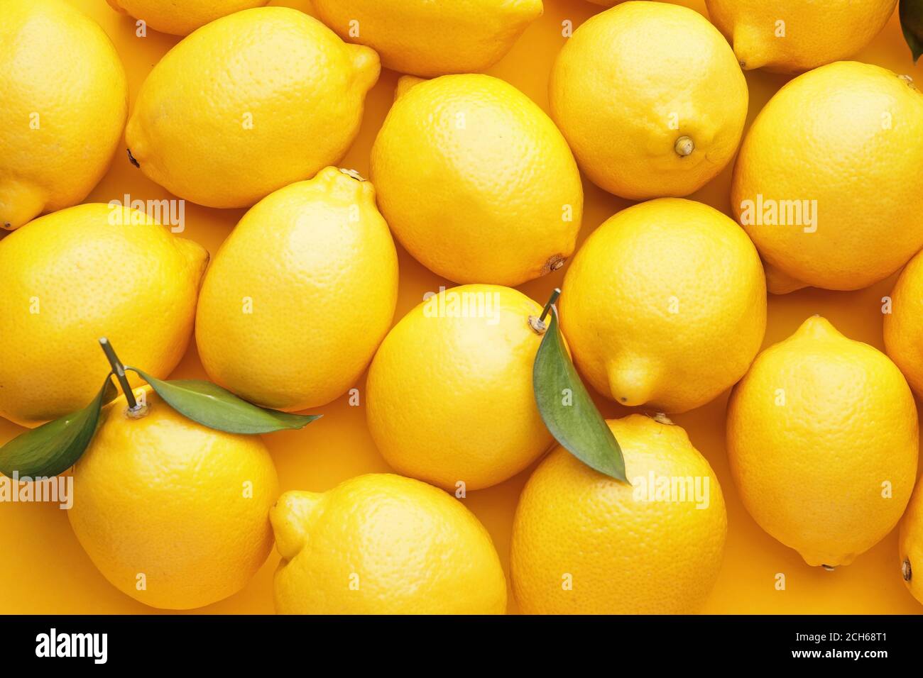 Fresh ripe lemons as background Stock Photo - Alamy