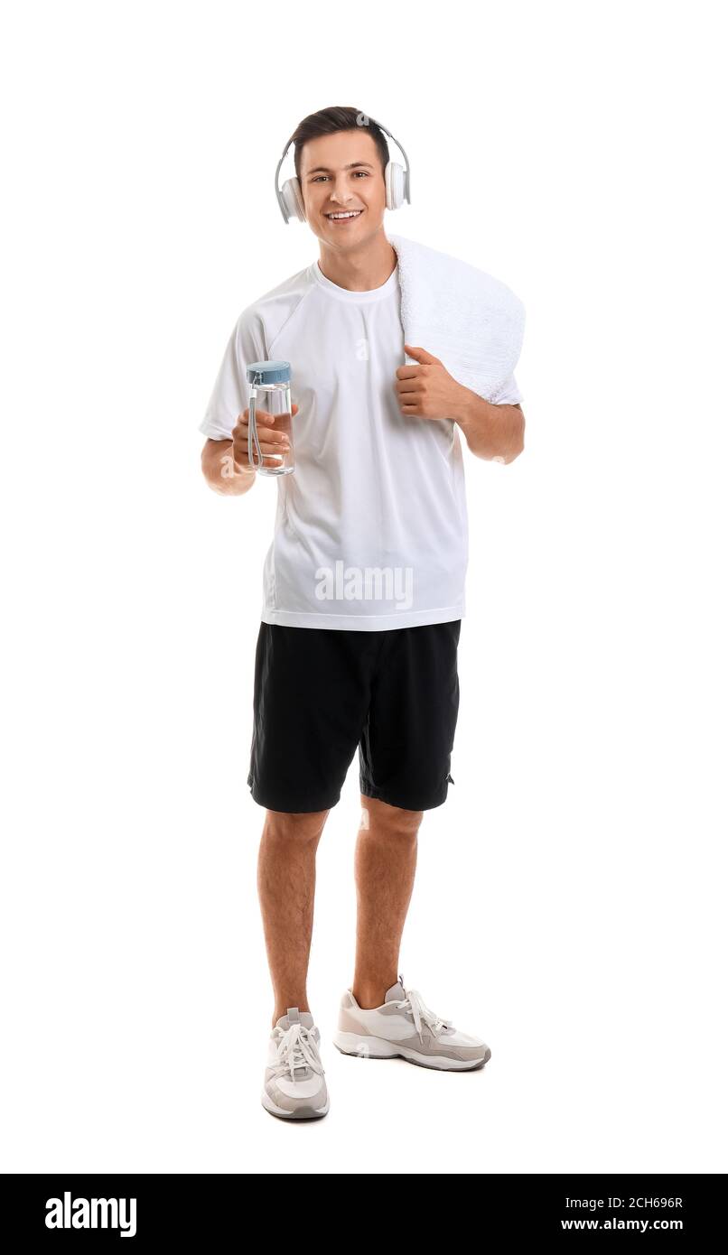 Sporty young man with bottle of water on white background Stock Photo ...