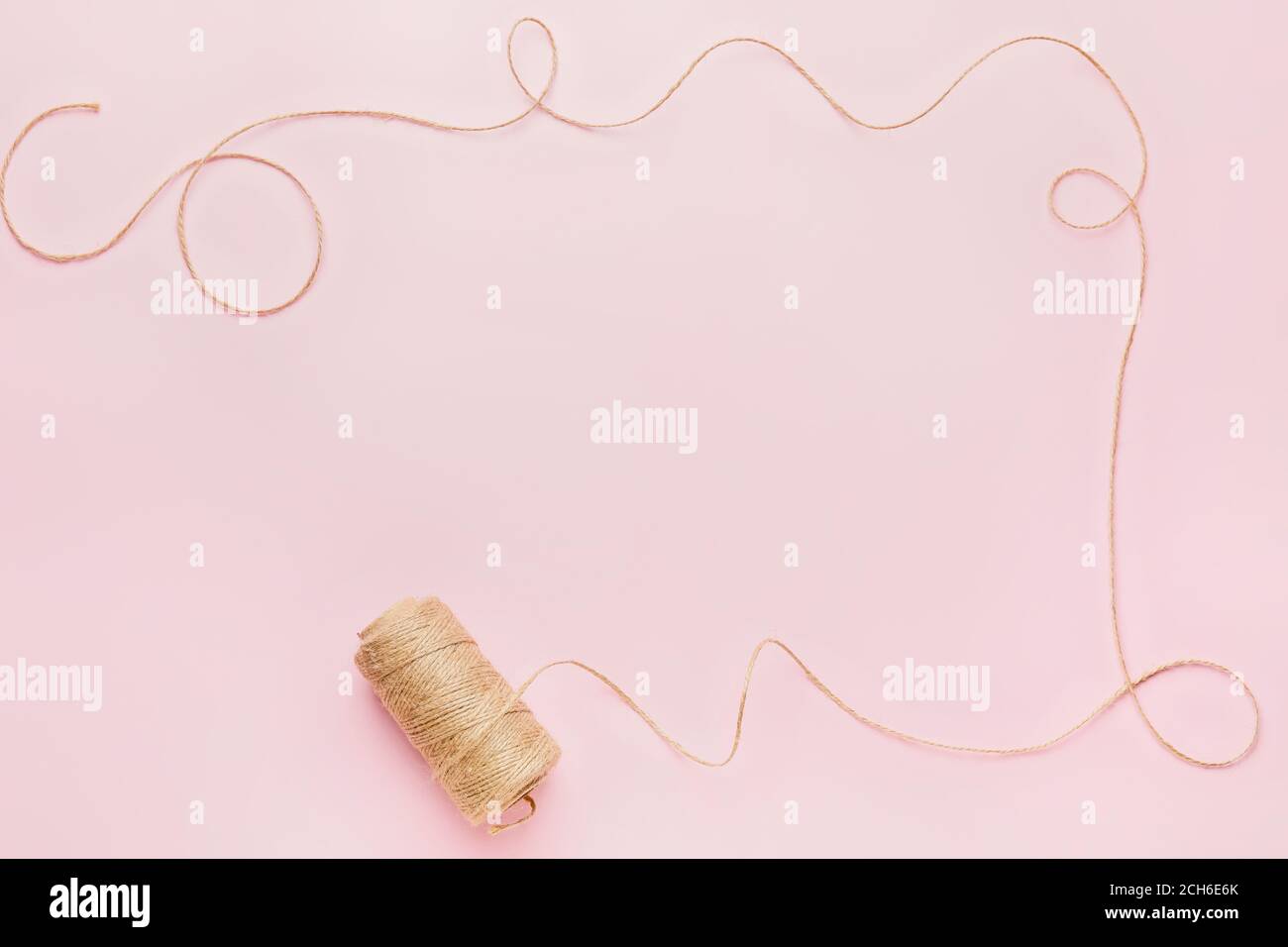 Frame made of thread on color background Stock Photo - Alamy