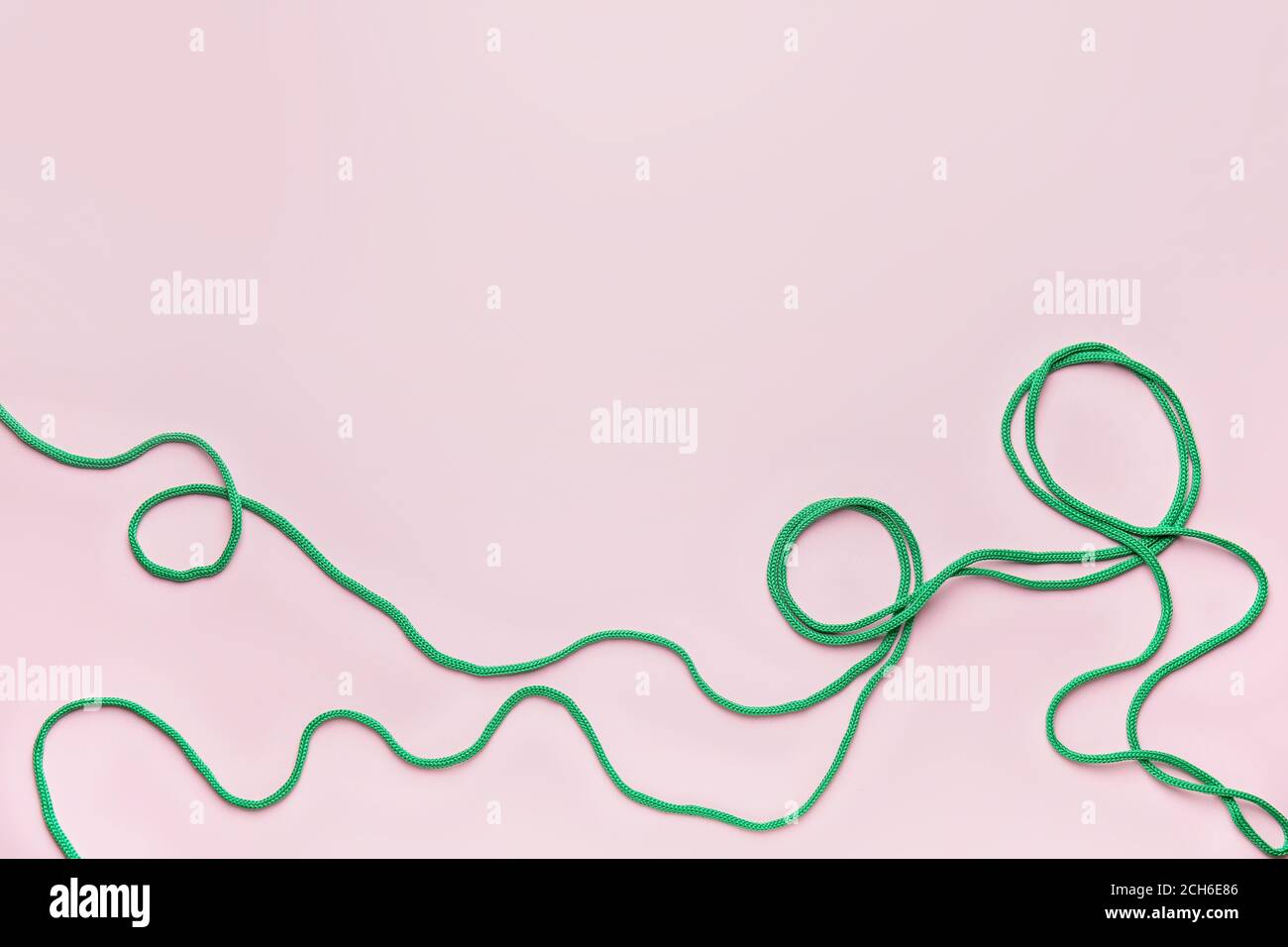 Long rope on color background Stock Photo - Alamy